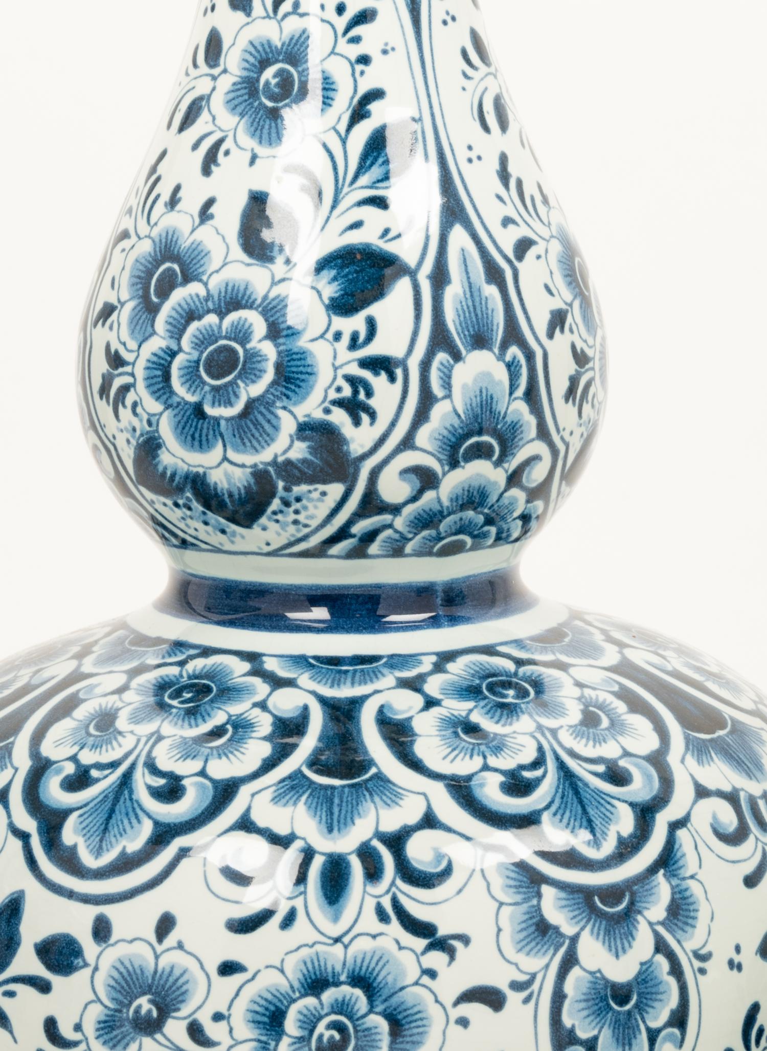 A Group of Eight Blue and White Earthenware Vases, Primarily Delft