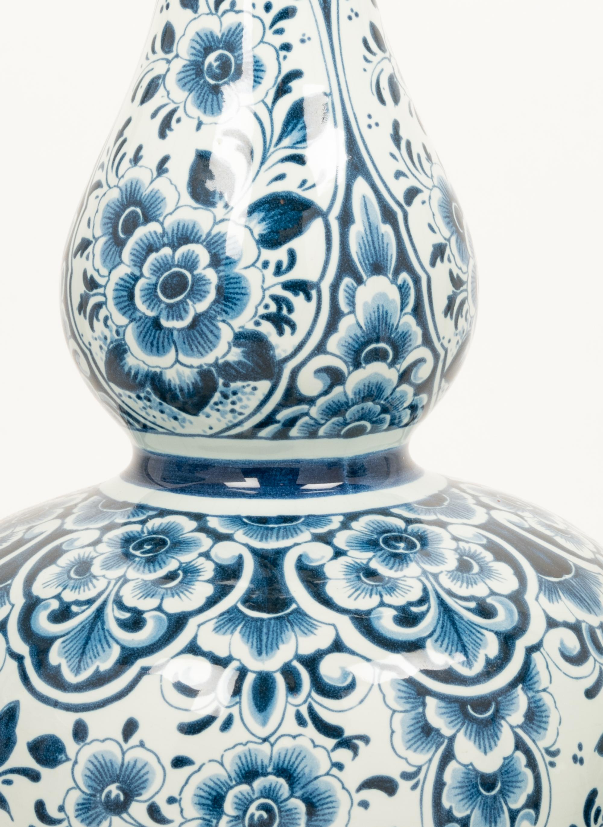A Group of Eight Blue and White Earthenware Vases, Primarily Delft