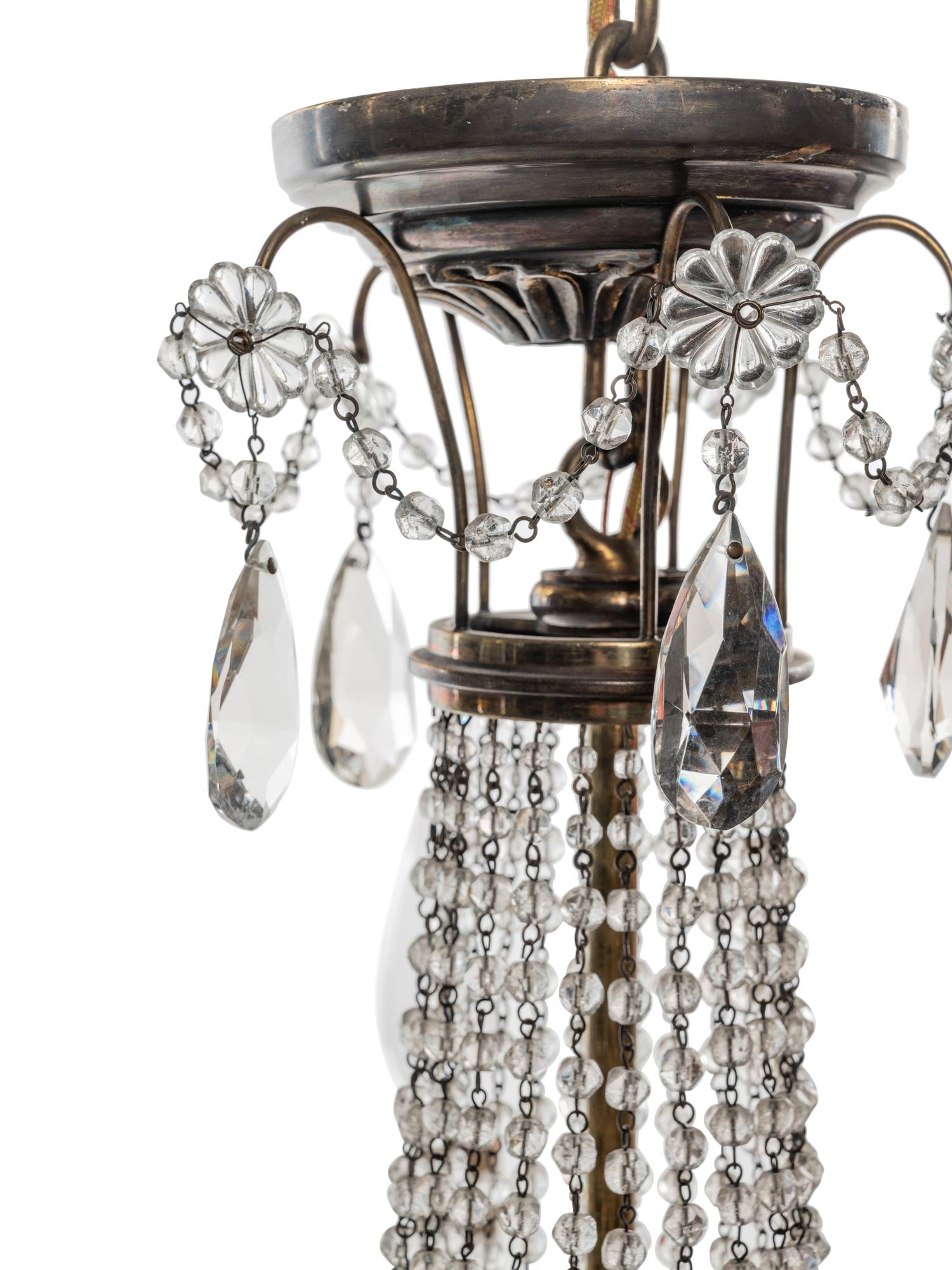 An Empire Style Brass and Cut Glass Five-Light Chandelier