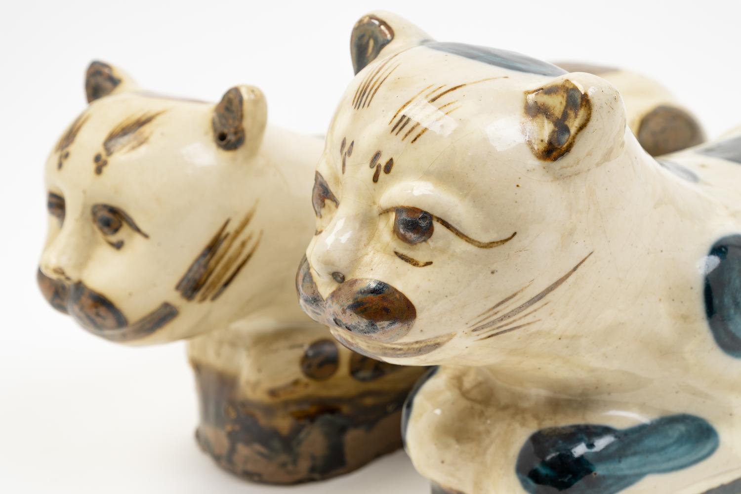 Two Chinese Beige Ground Porcelain 'Cat' Pillows