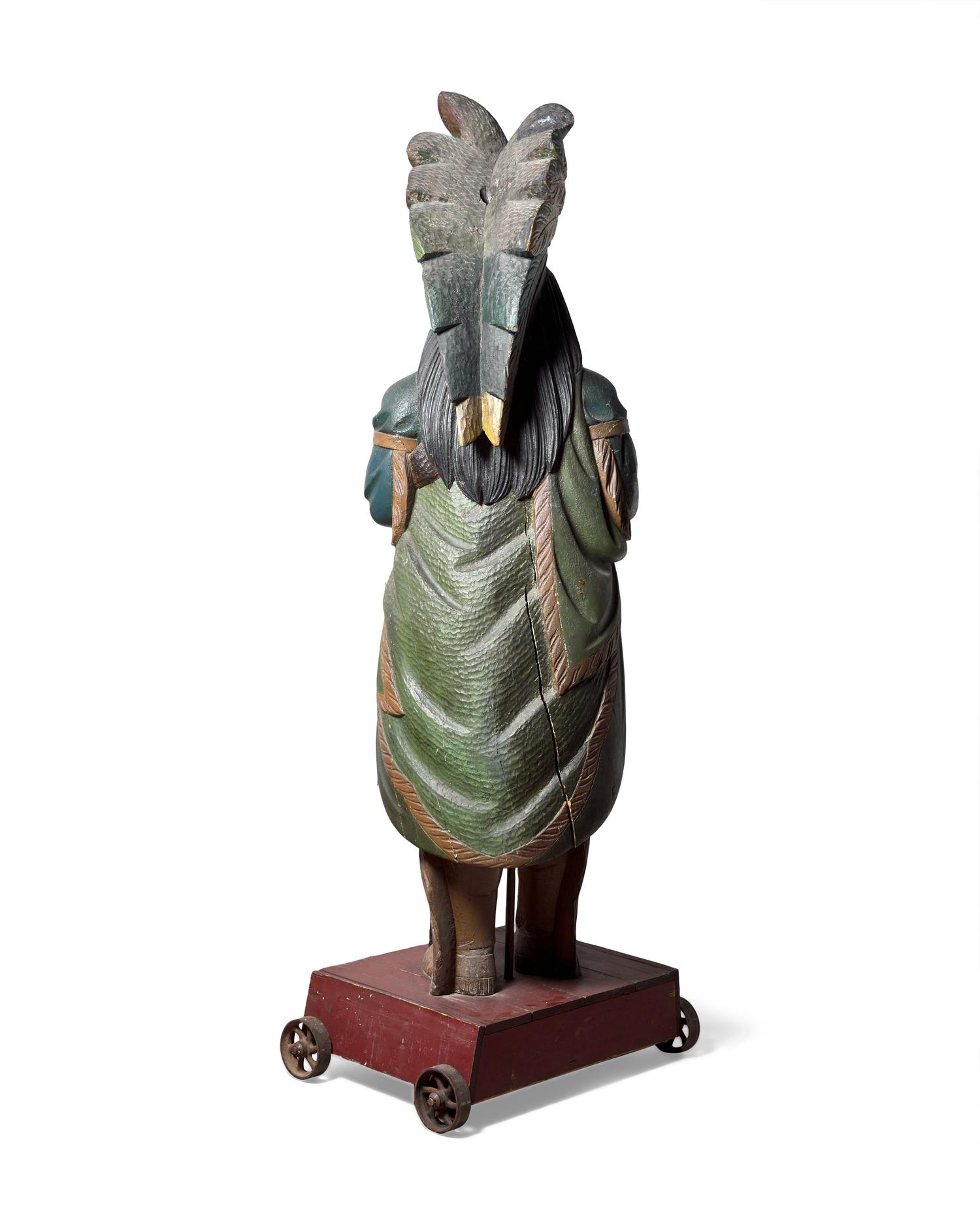 A Carved and Polychrome Painted Tobacconist Figure