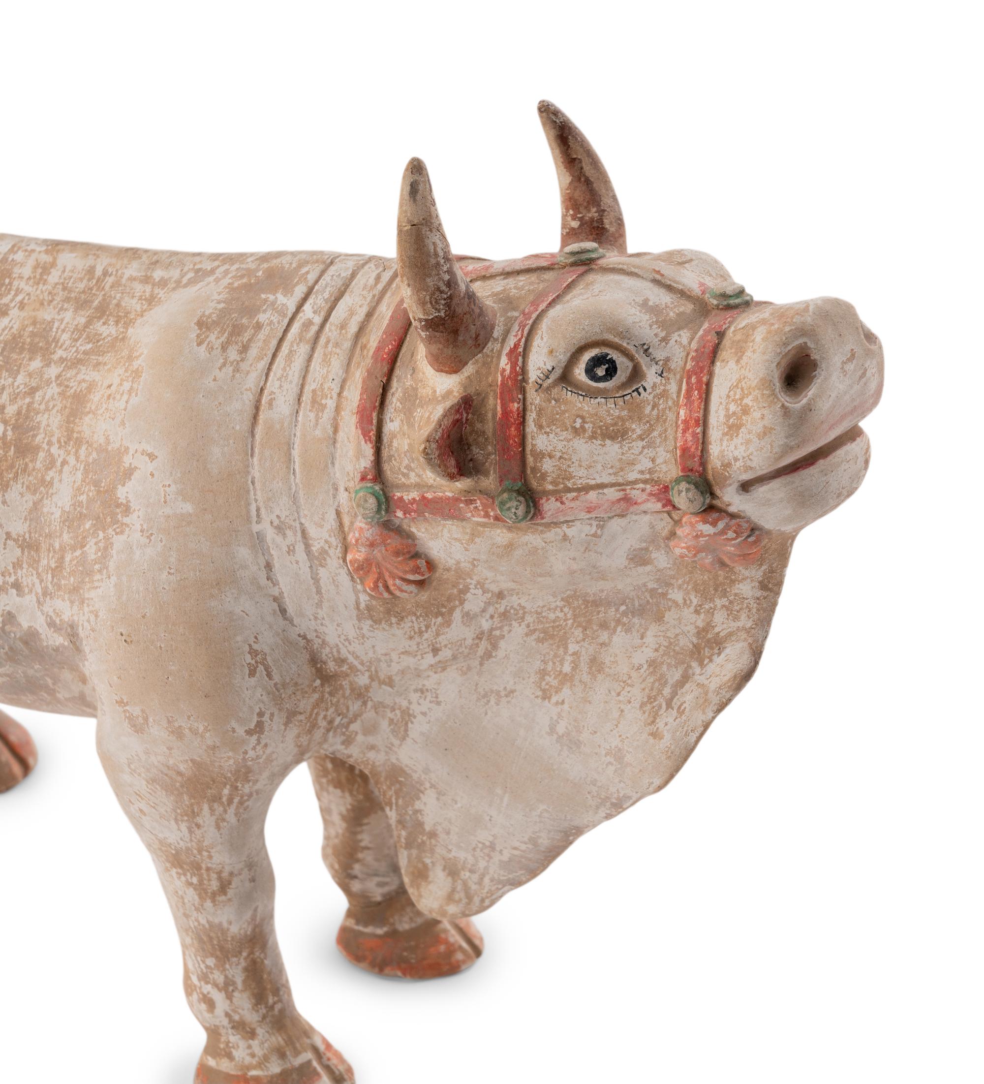 A Pair of Chinese Painted Pottery Figures of Oxen