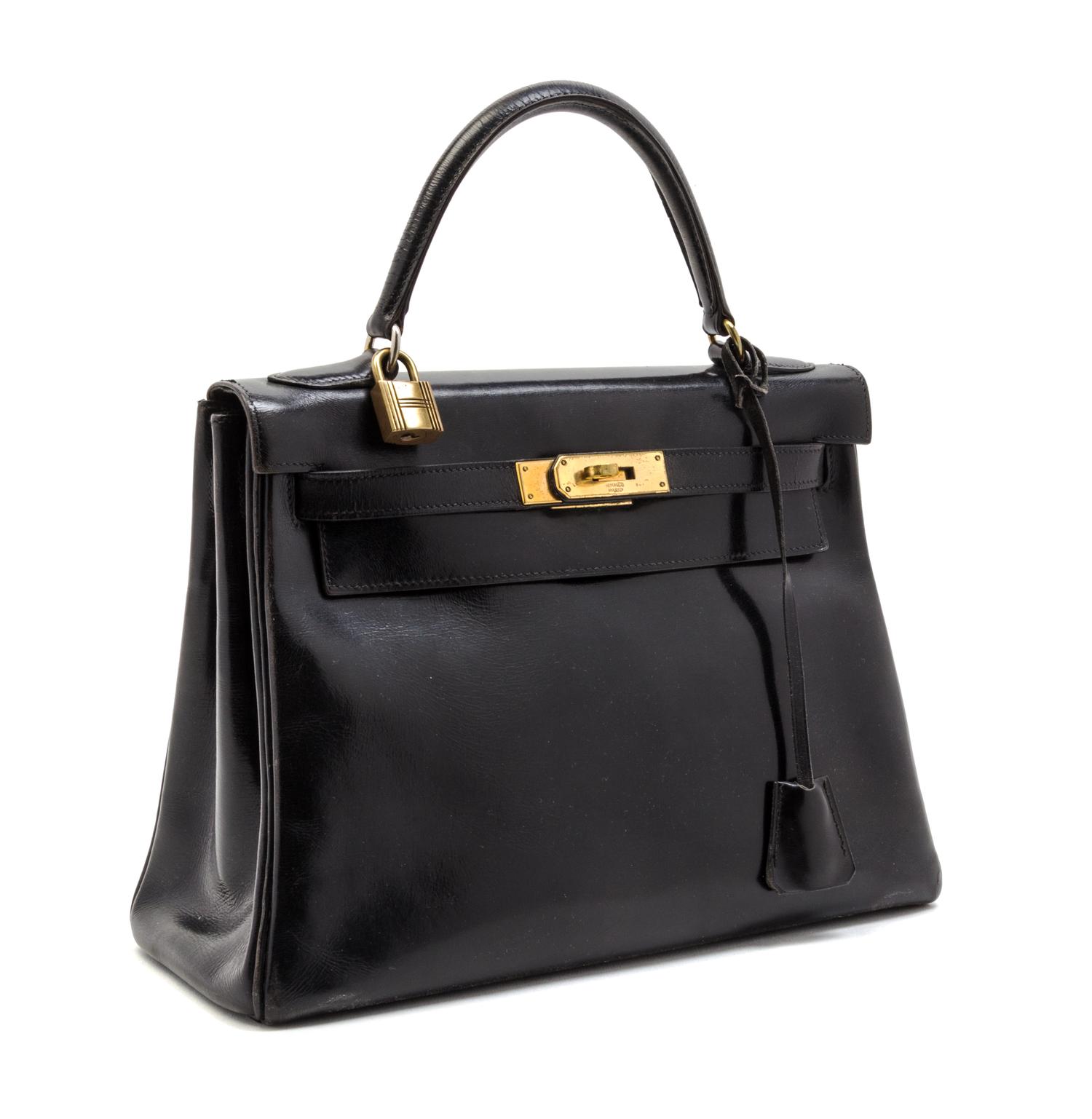 An Hermes 28cm Black Calf Leather Kelly Bag, 11 x 8 x 4 1/2 inches.