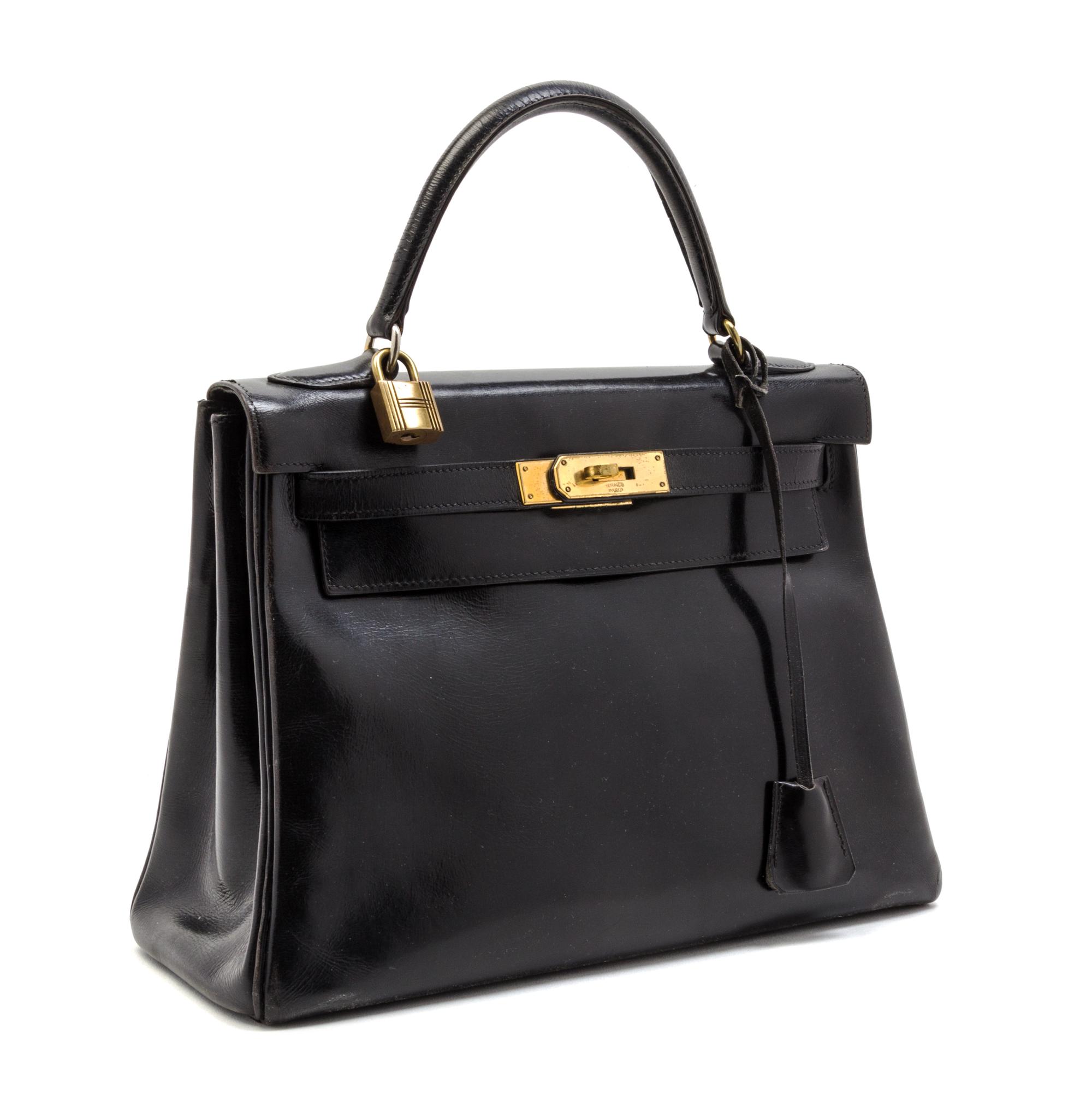 An Hermes 28cm Black Calf Leather Kelly Bag, 11 x 8 x 4 1/2 inches.