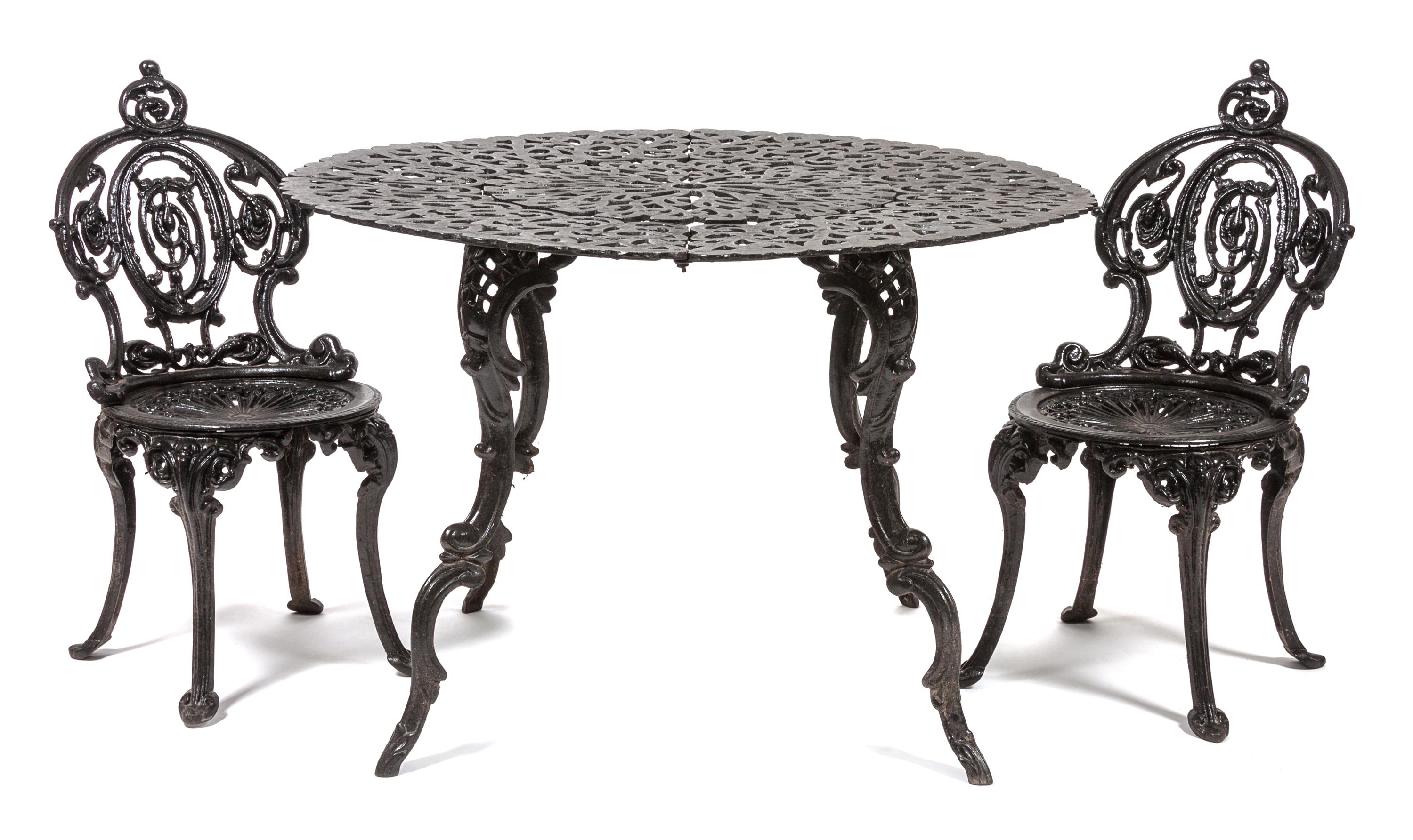 A Victorian Style Wrought Iron Patio Set Height of chairs 31 1/2 inches. — 20TH CENTURY