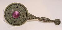 A Victorian Jewel Mounted and Engine Turned Enamel Hand Mirror Length 14 1/2 inches.