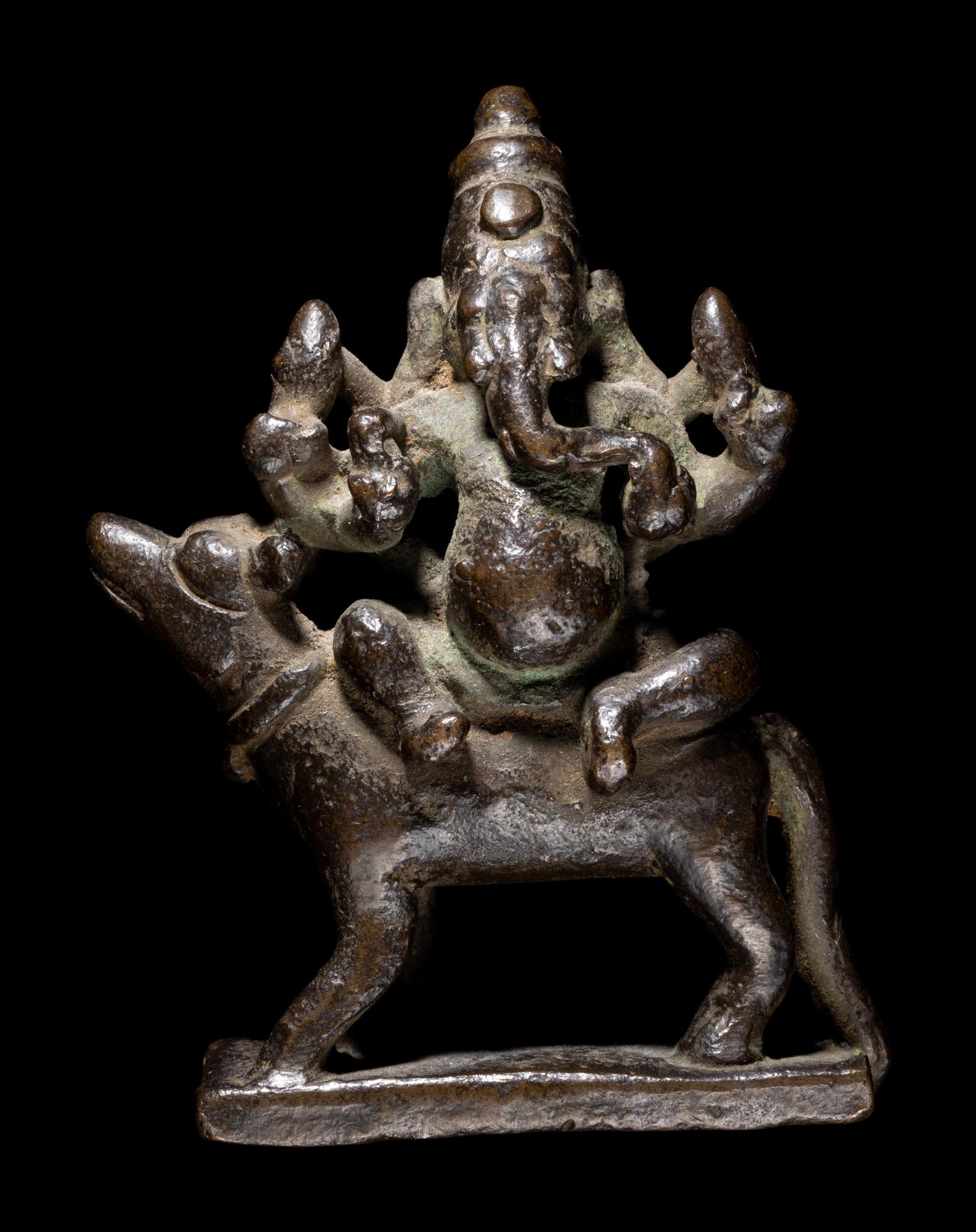 An Indian Bronze Figure of Ganesha Mounted