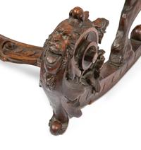 An Italian Carved Walnut Fantasy Rocking Chair