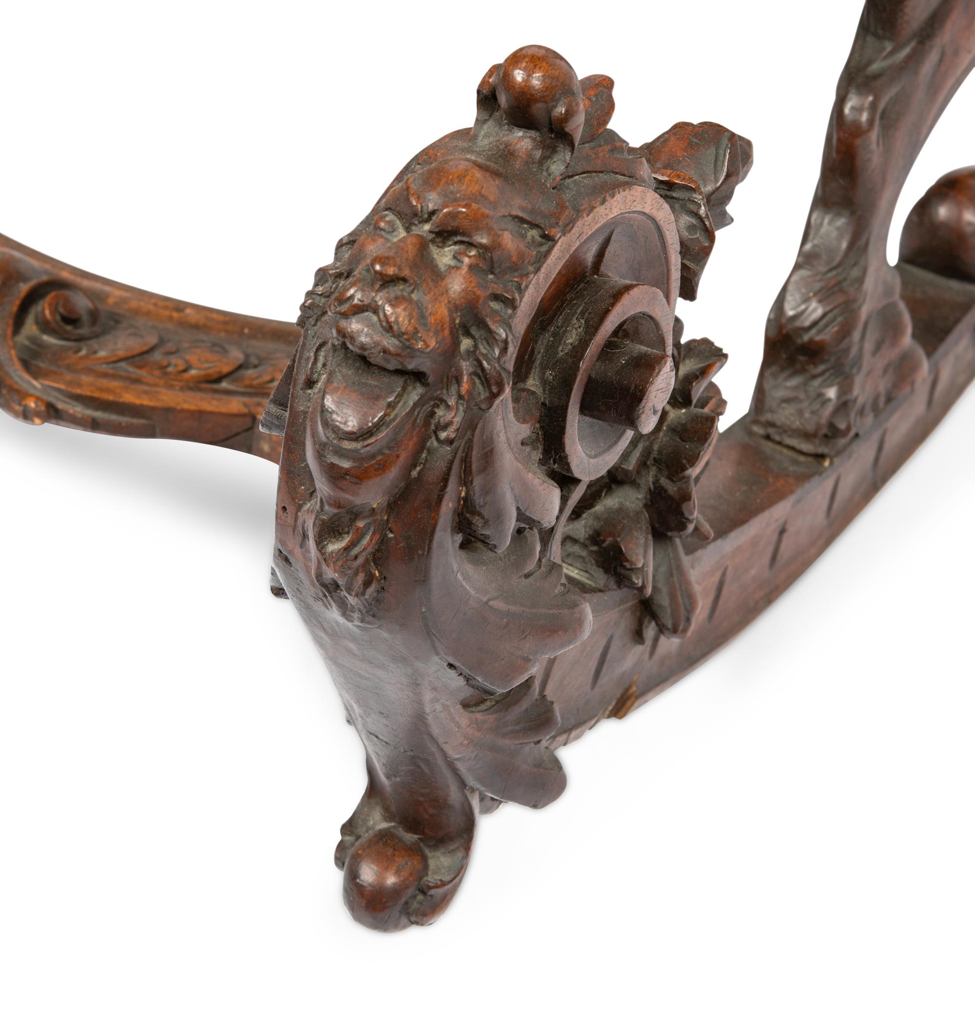 An Italian Carved Walnut Fantasy Rocking Chair