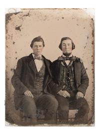 [CIVIL WAR]. Sixth plate ambrotype of CSA soldier John Adams, Jr., possibly from Company, B, 16th South Carolina Volunteers, holding a Confederate-made Spiller & Burr revolver, with civilian portrait.