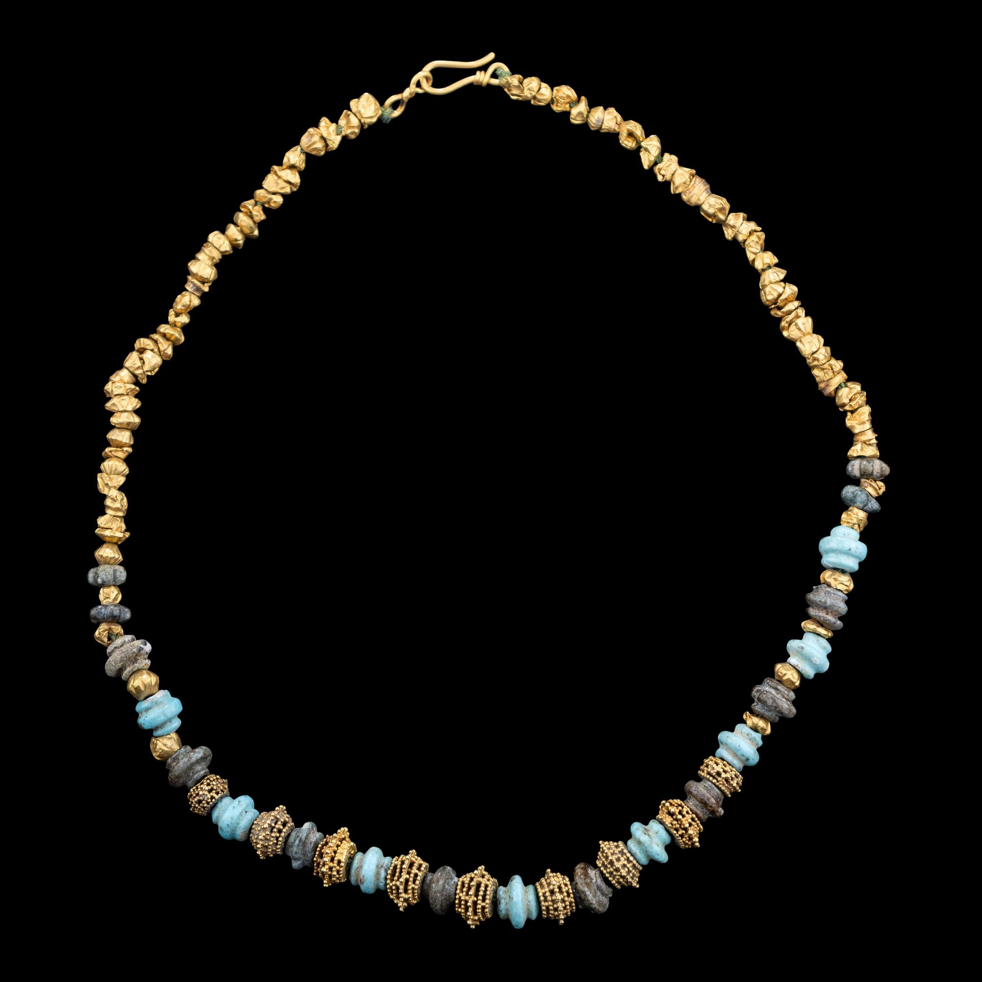 An Western Asiatic Stone Beaded Necklace with Ancient Gold Spacers