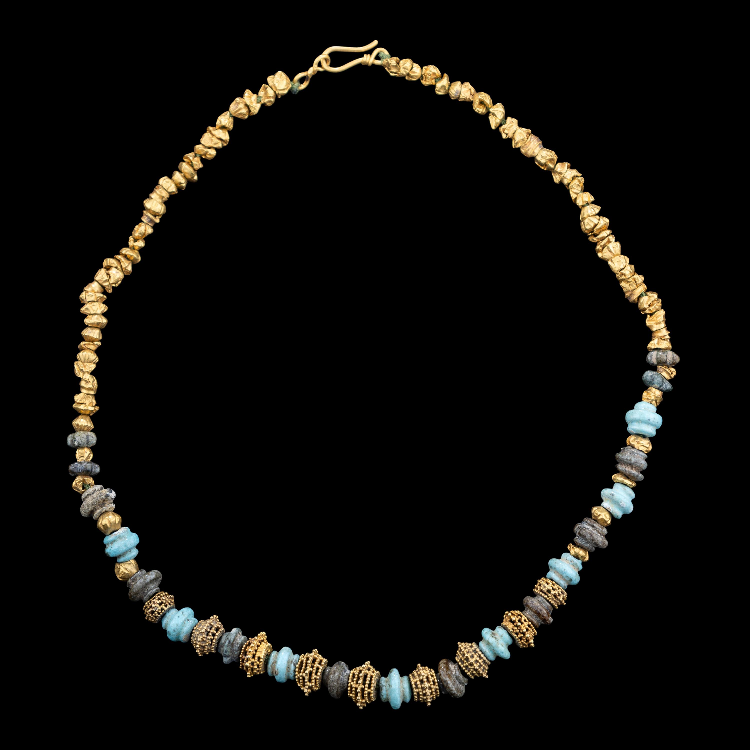An Western Asiatic Stone Beaded Necklace with Ancient Gold Spacers