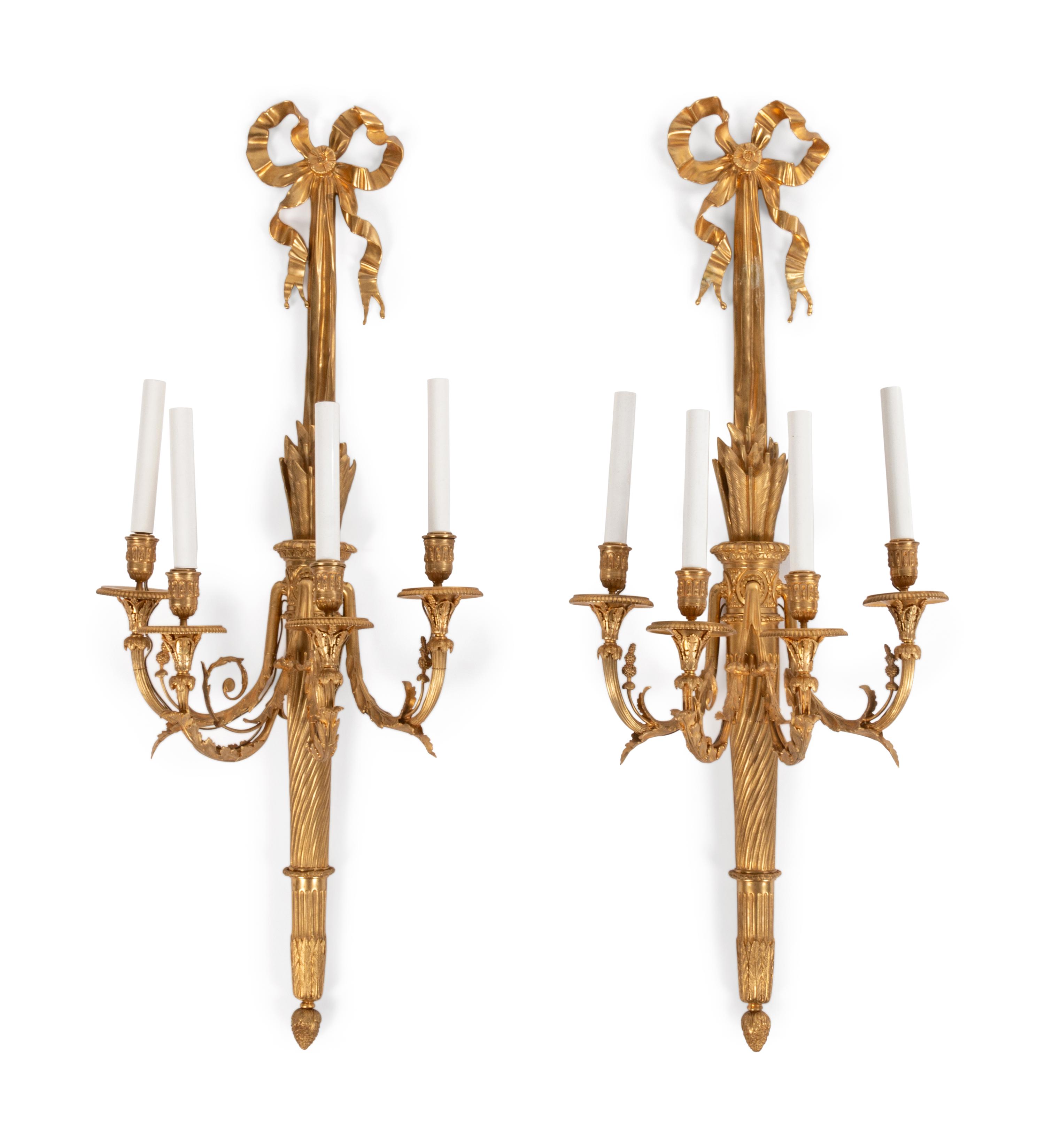 A Pair of Louis XVI Style Gilt Bronze Four-Light Wall Sconces