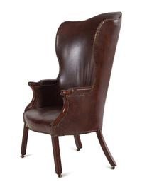 An English Leather Upholstered Mahogany Wingback Armchair