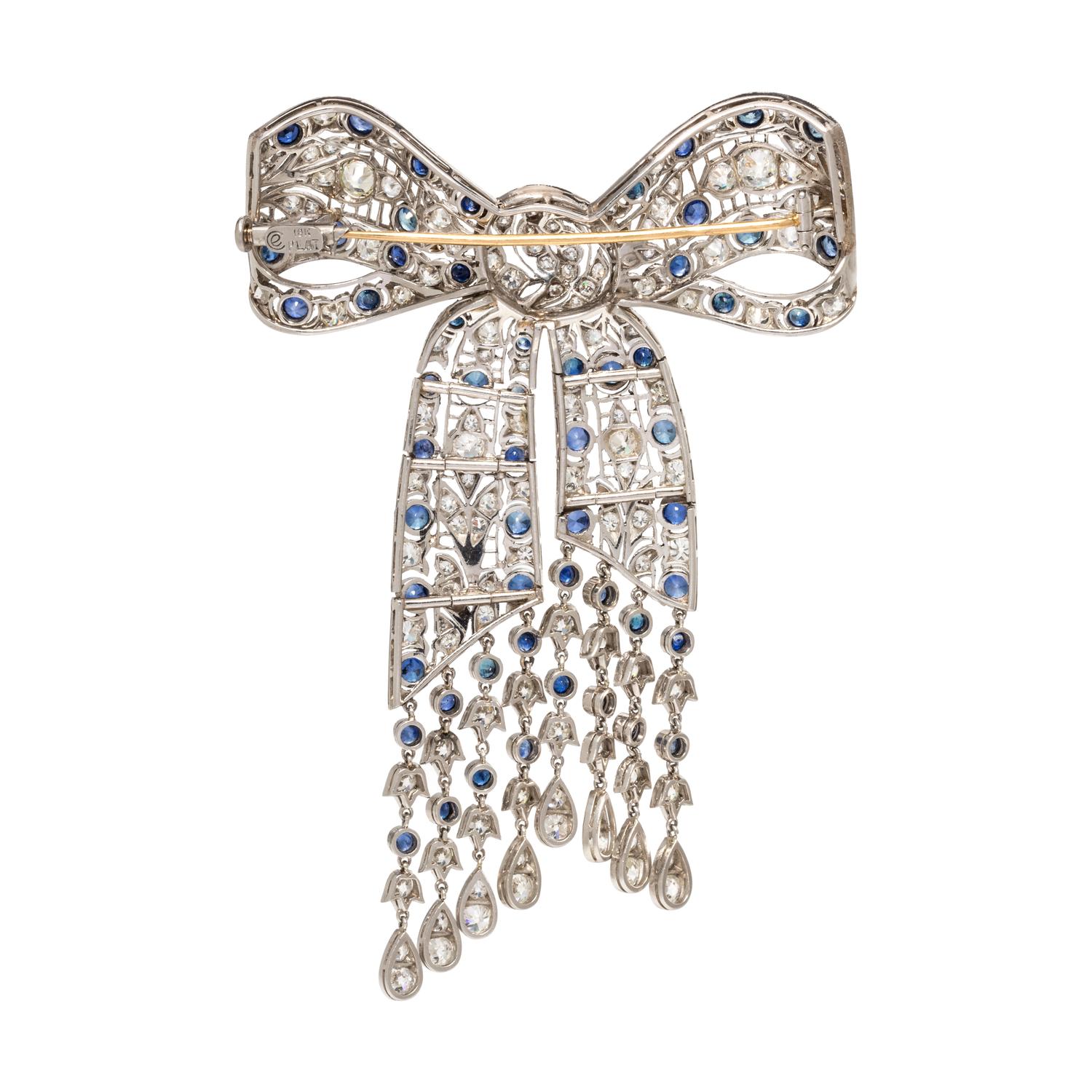 EVELYN CLOTHIER, DIAMOND AND SAPPHIRE BOW BROOCH