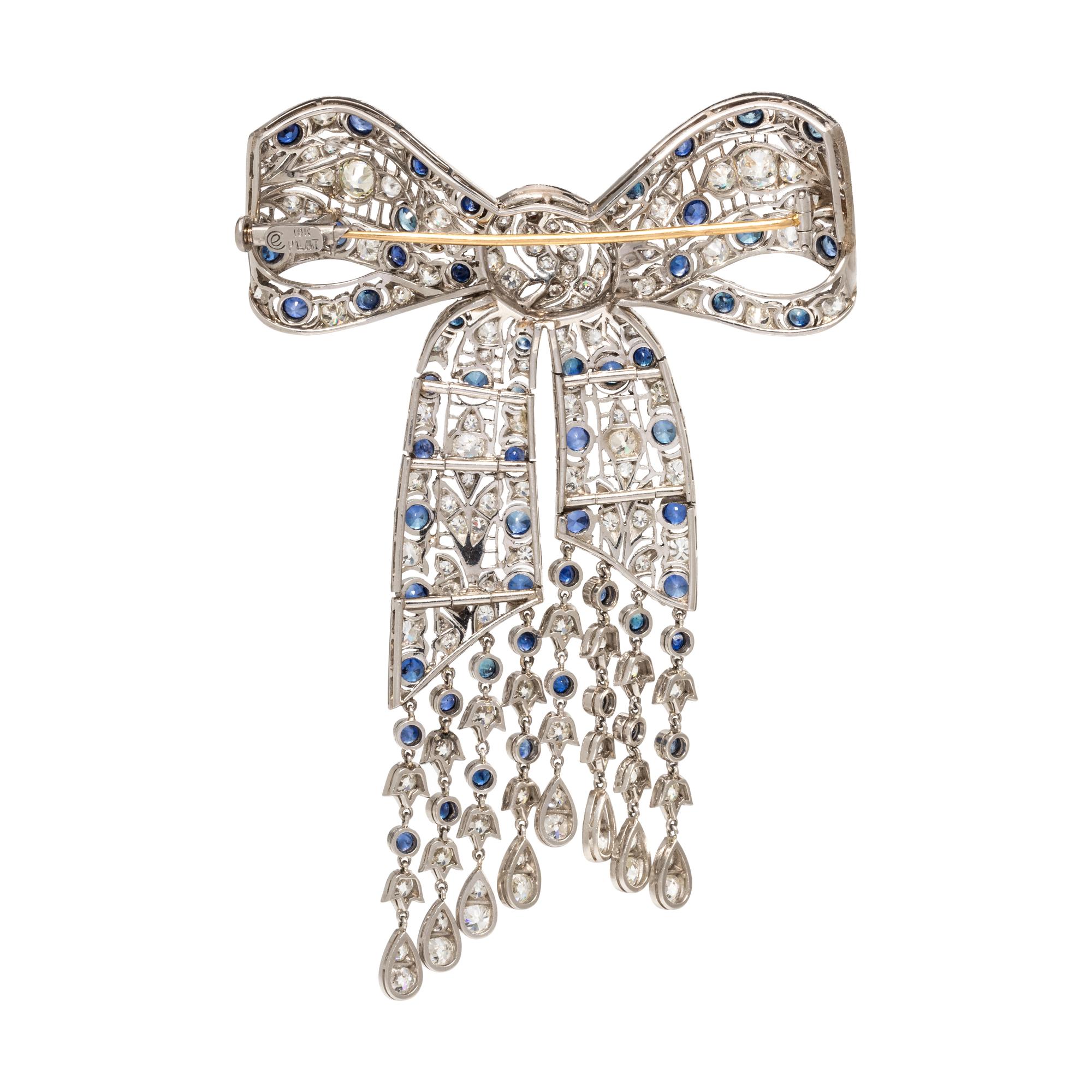 EVELYN CLOTHIER, DIAMOND AND SAPPHIRE BOW BROOCH