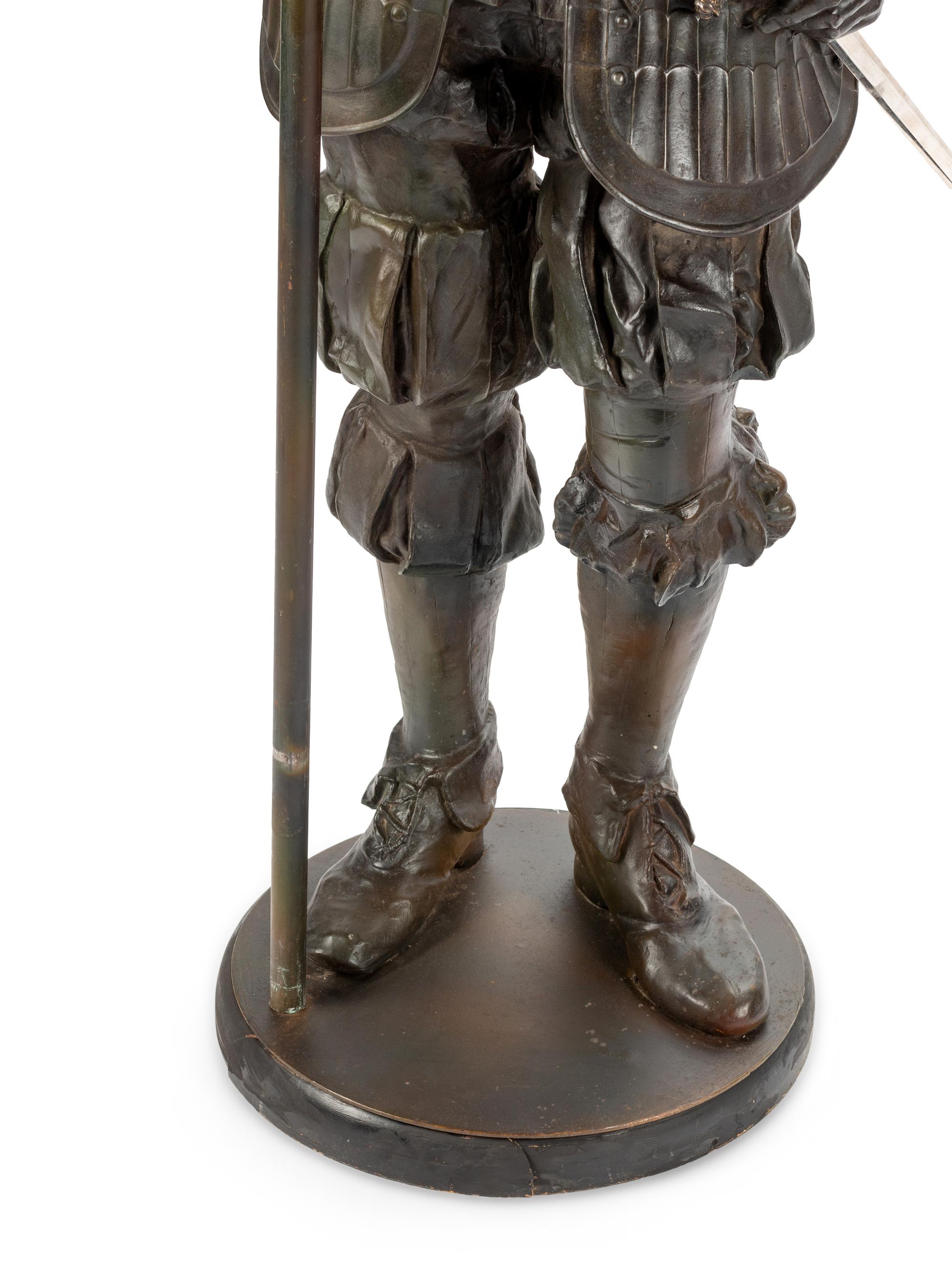 A Pair of Cast Metal Figural Torchères