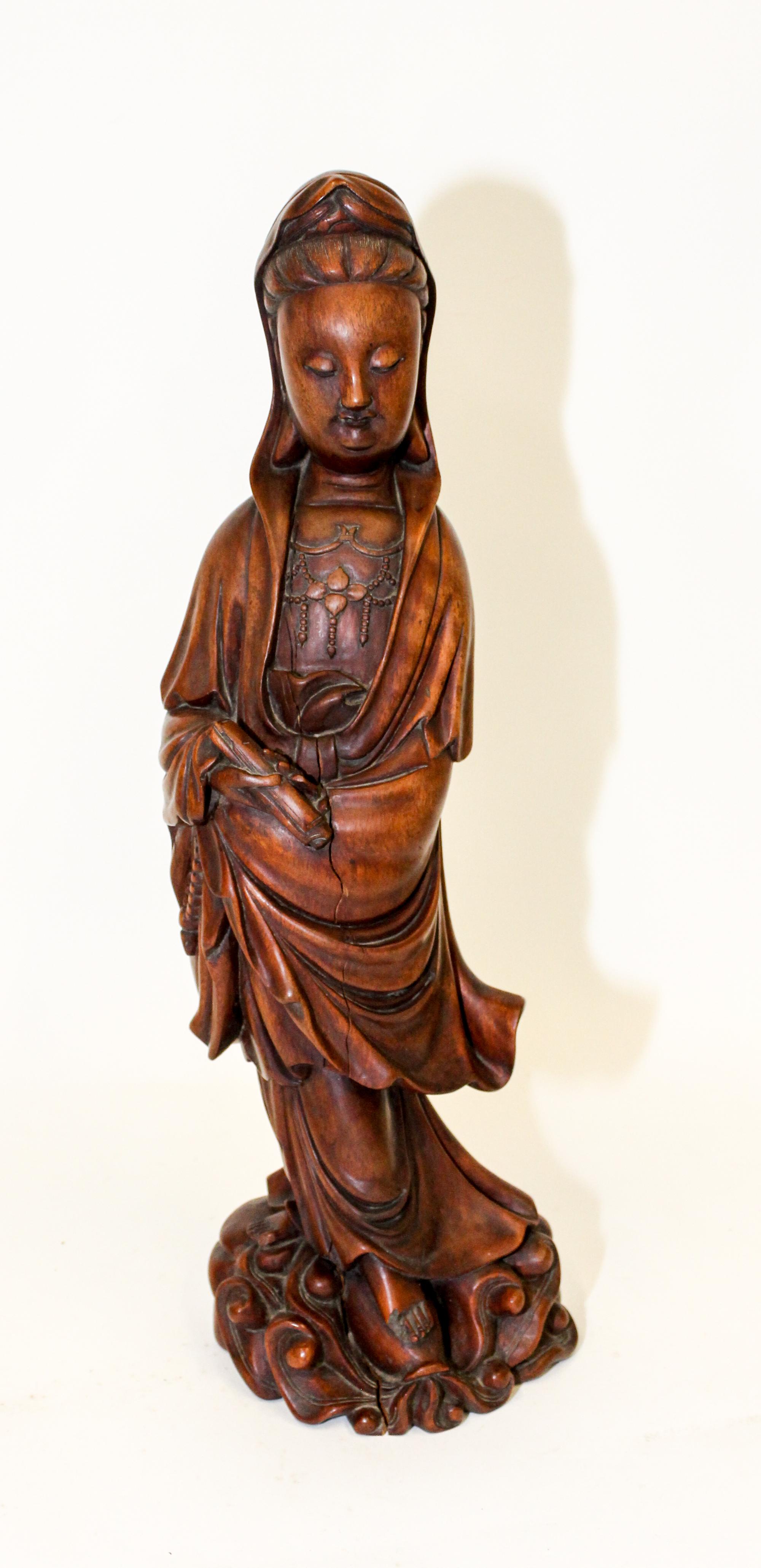 A Chinese Carved Wood Figure of Guanyin Height 17 1/4 inches.