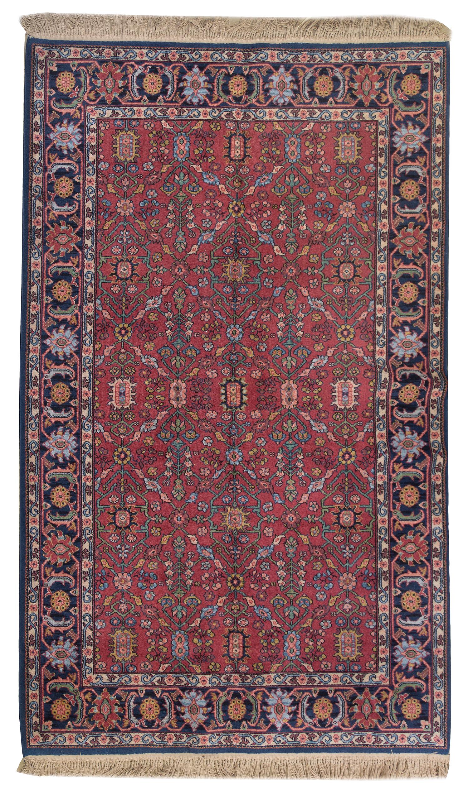 A Persian Wool Rug, 5 feet 10 inches x 9 feet.