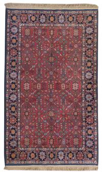 A Persian Wool Rug, 5 feet 10 inches x 9 feet.