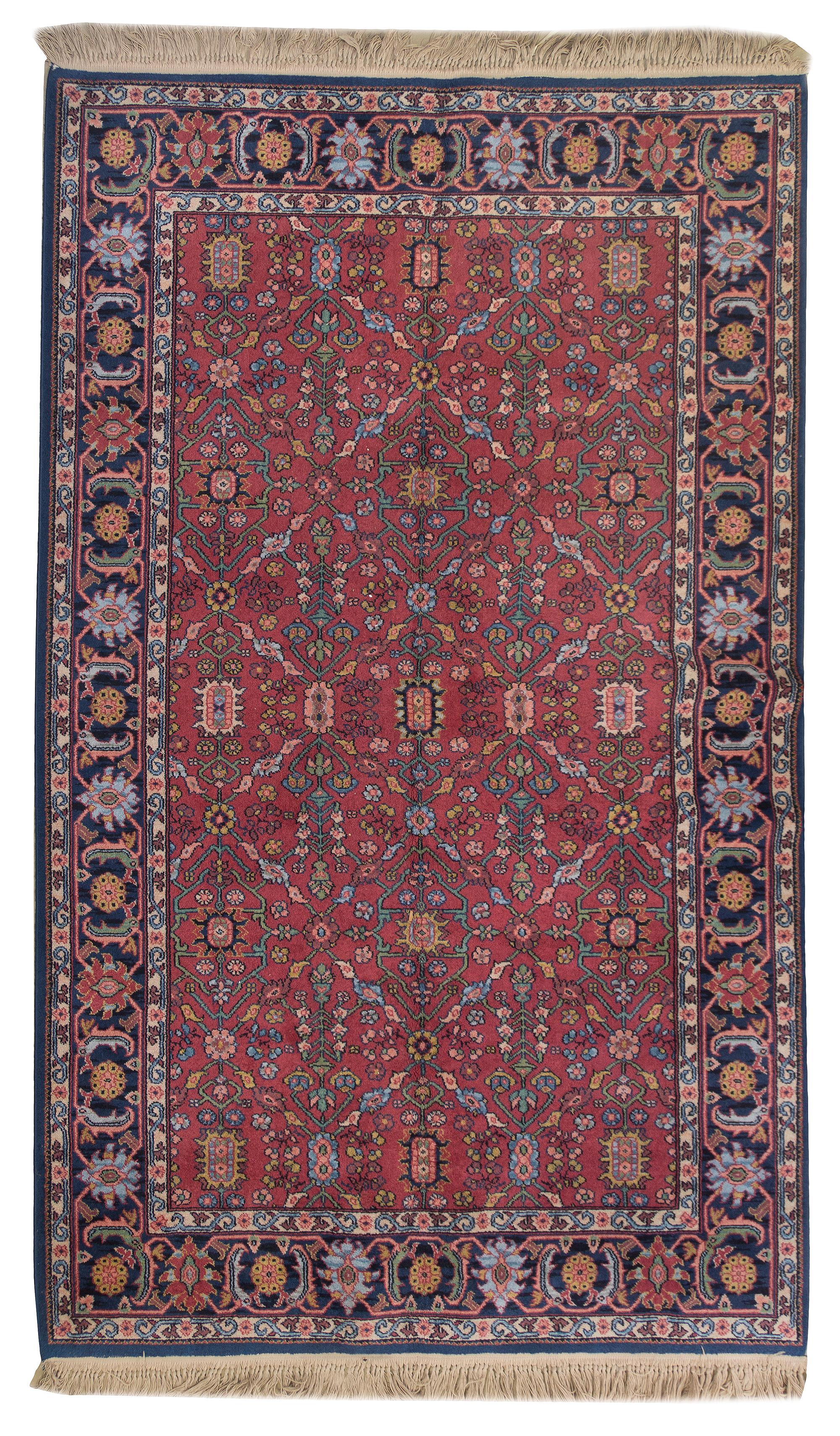 A Persian Wool Rug, 5 feet 10 inches x 9 feet.