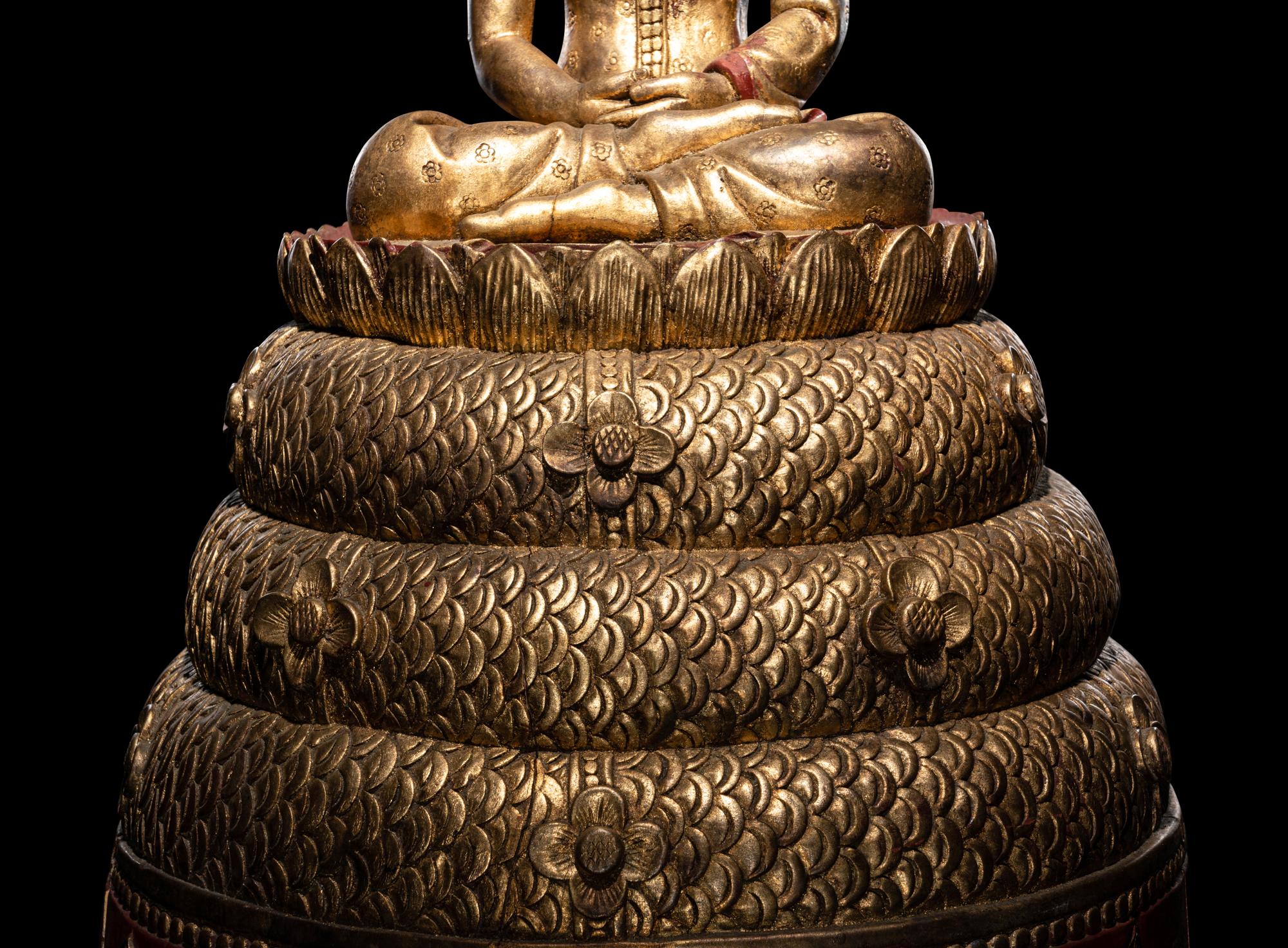 A Large Thait Gilt and Red Lacquered Wood Figure of Buddha