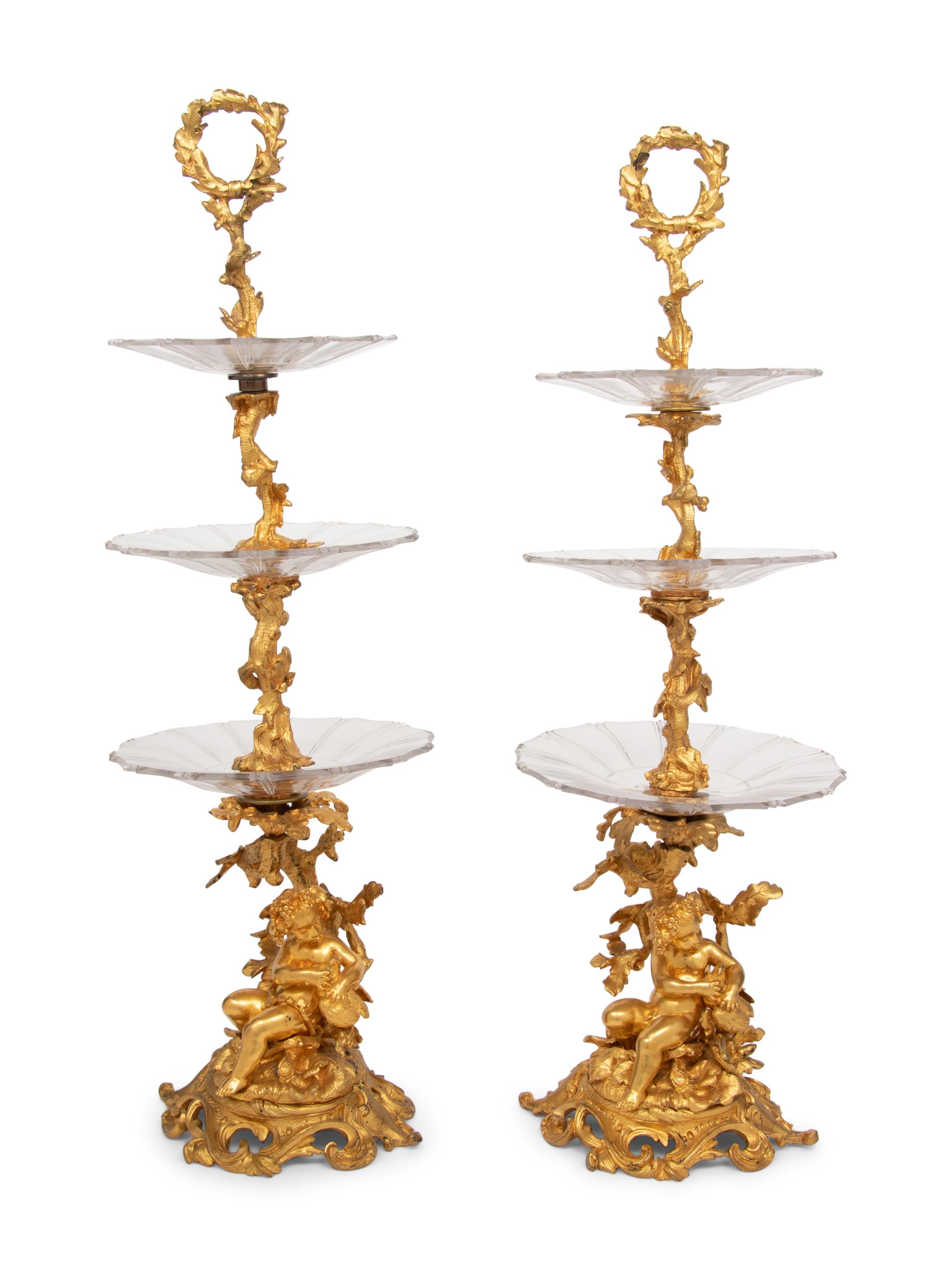 A Pair of French Gilt Bronze and Glass Three-Tier Stands