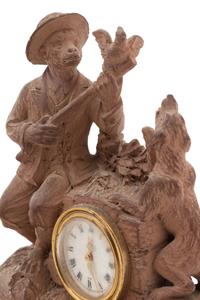 A Continental Terra Cotta Figural Clock