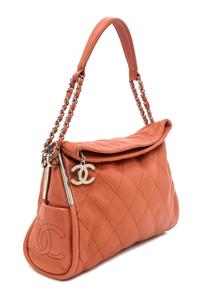 A Chanel Coral Calfskin Leather Quilted Fold Over Handbag, 12.5" x 11" x 4.5".