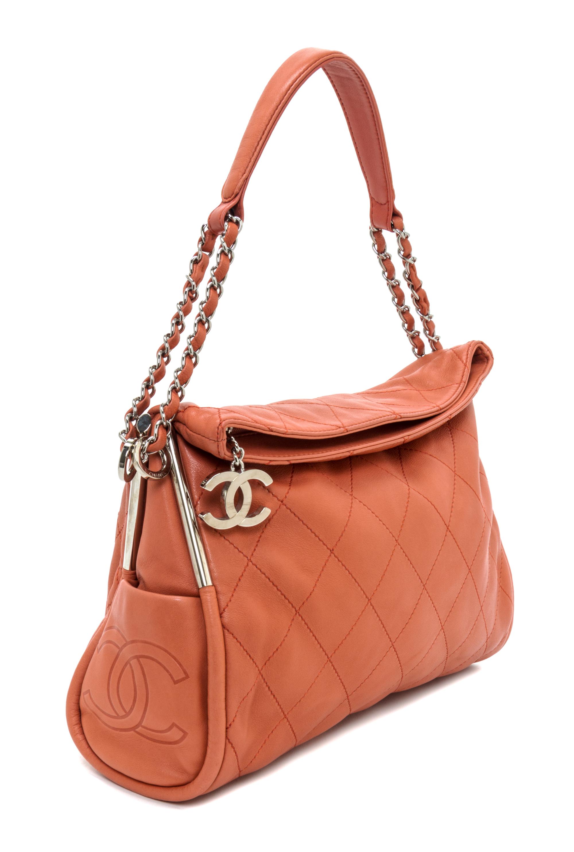 A Chanel Coral Calfskin Leather Quilted Fold Over Handbag, 12.5" x 11" x 4.5".