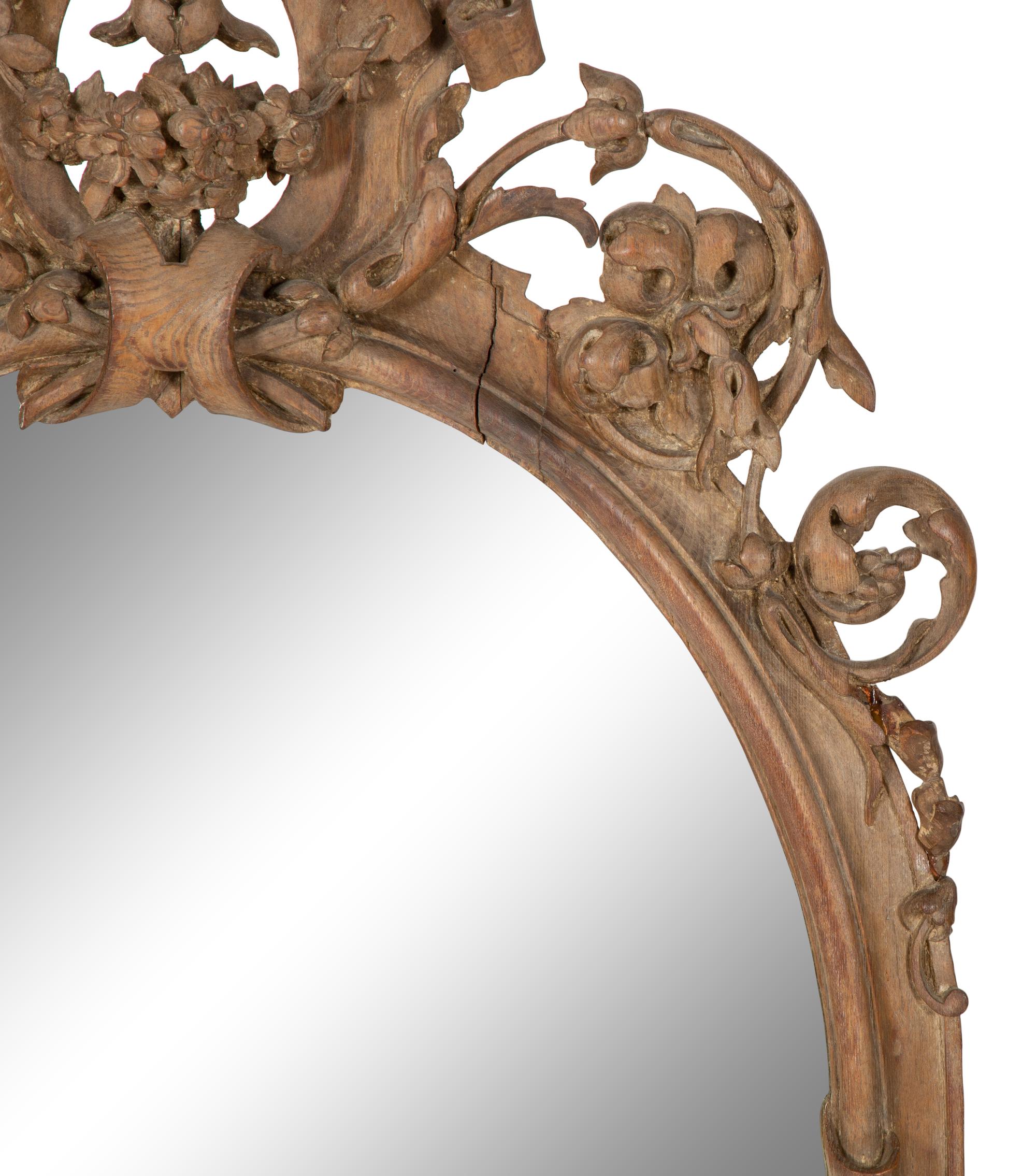 An Italian Baroque Style Carved Walnut Mirror