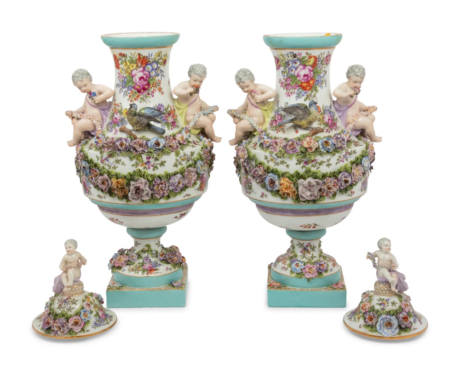 A Pair of Continental Porcelain Urns