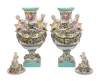A Pair of Continental Porcelain Urns