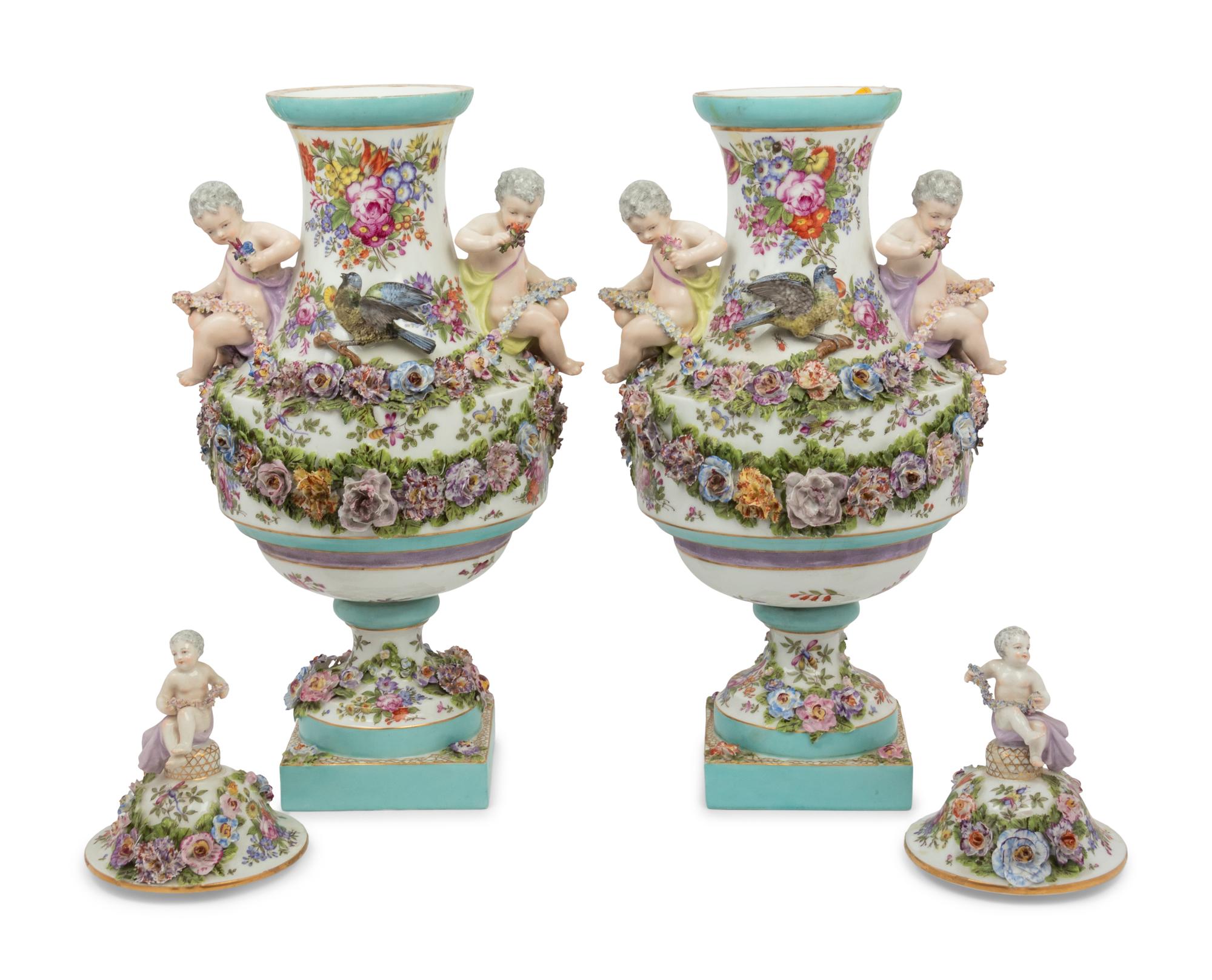 A Pair of Continental Porcelain Urns