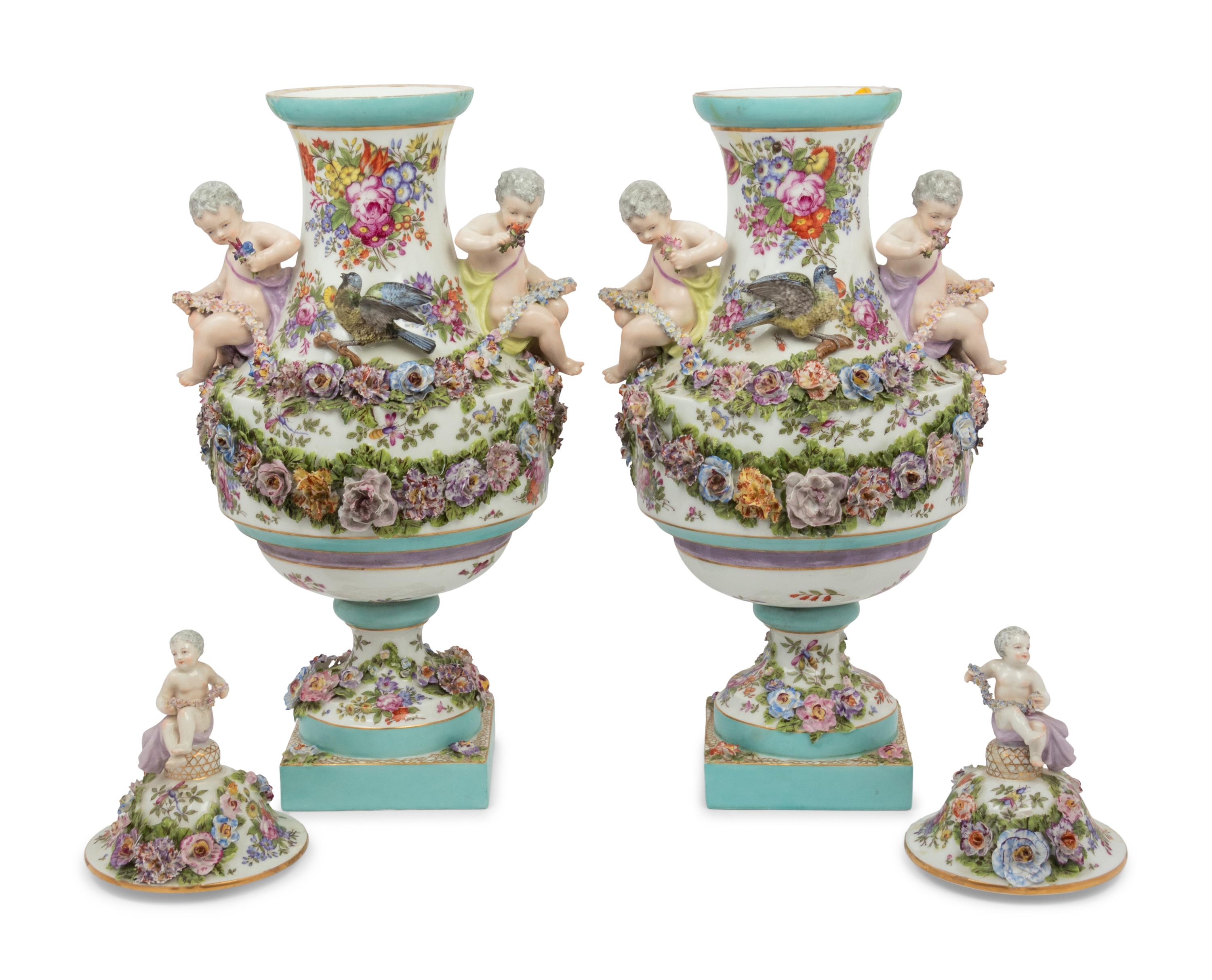 A Pair of Continental Porcelain Urns