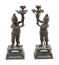 A Pair of Bronze 'Boy' Candle Holders