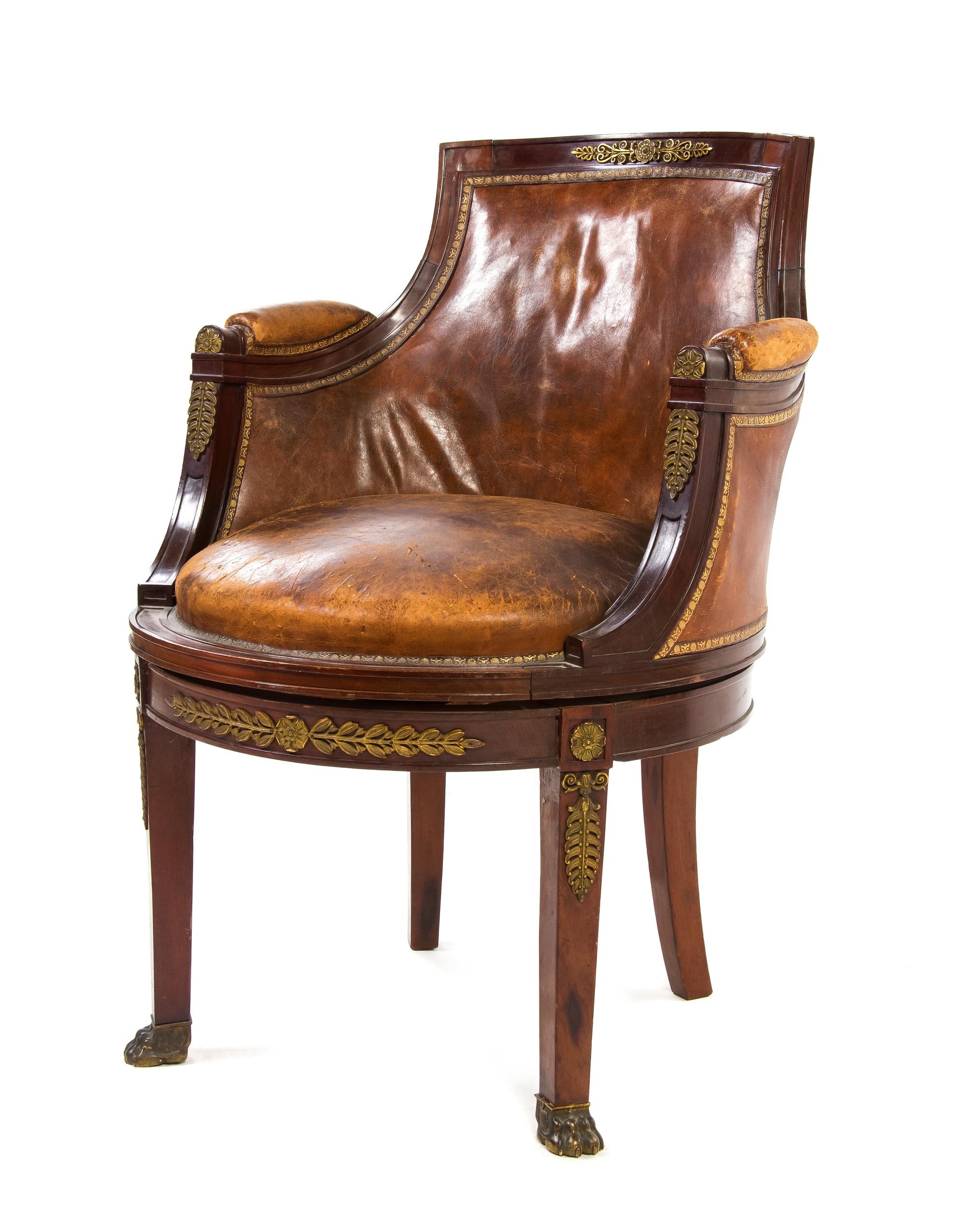 An Empire Gilt Bronze Mounted Mahogany Bergere, Height 34 1/4 inches.
