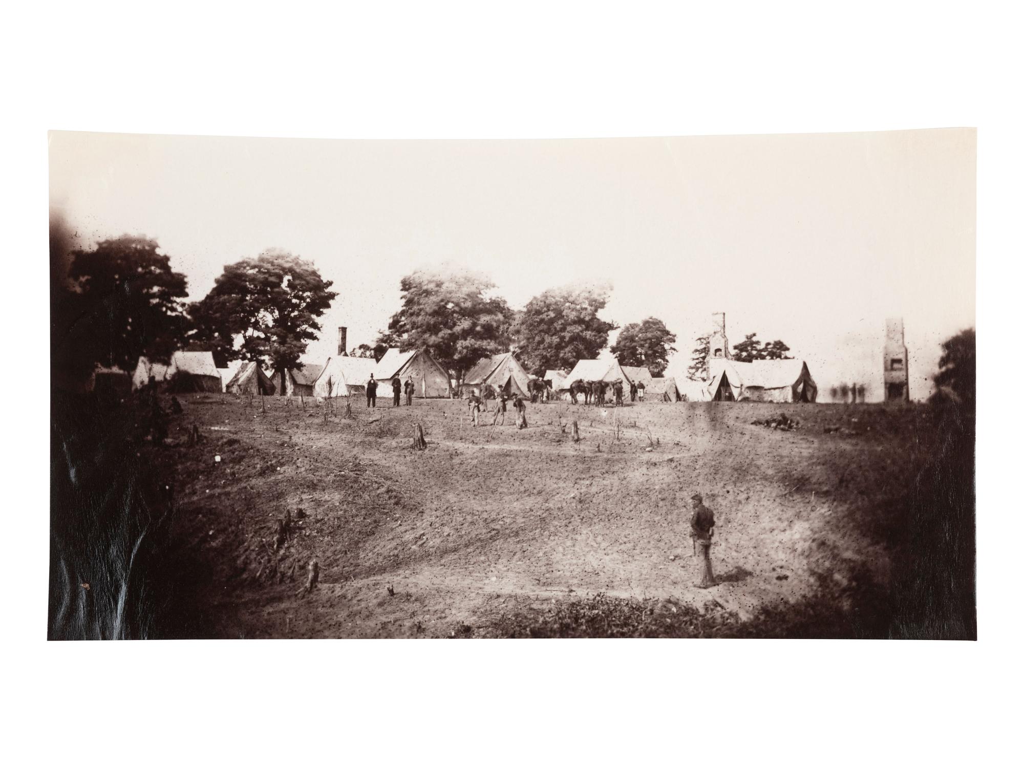 [CIVIL WAR]. Photographer unknown. Unidentified Union Encampment with ruined chimneys in the background. 1861-1865.