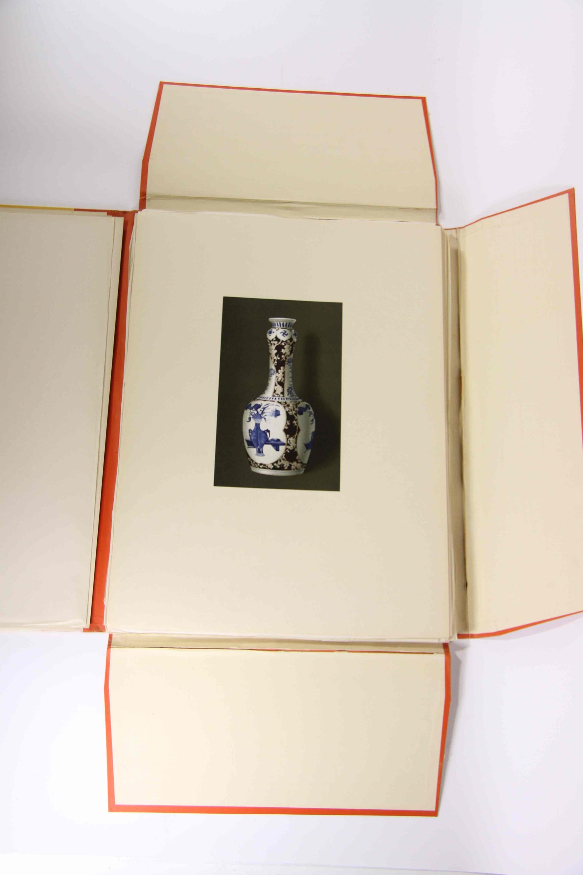 A Group of Four Ceramic Plates Height of tallest 22 1/2 inches.