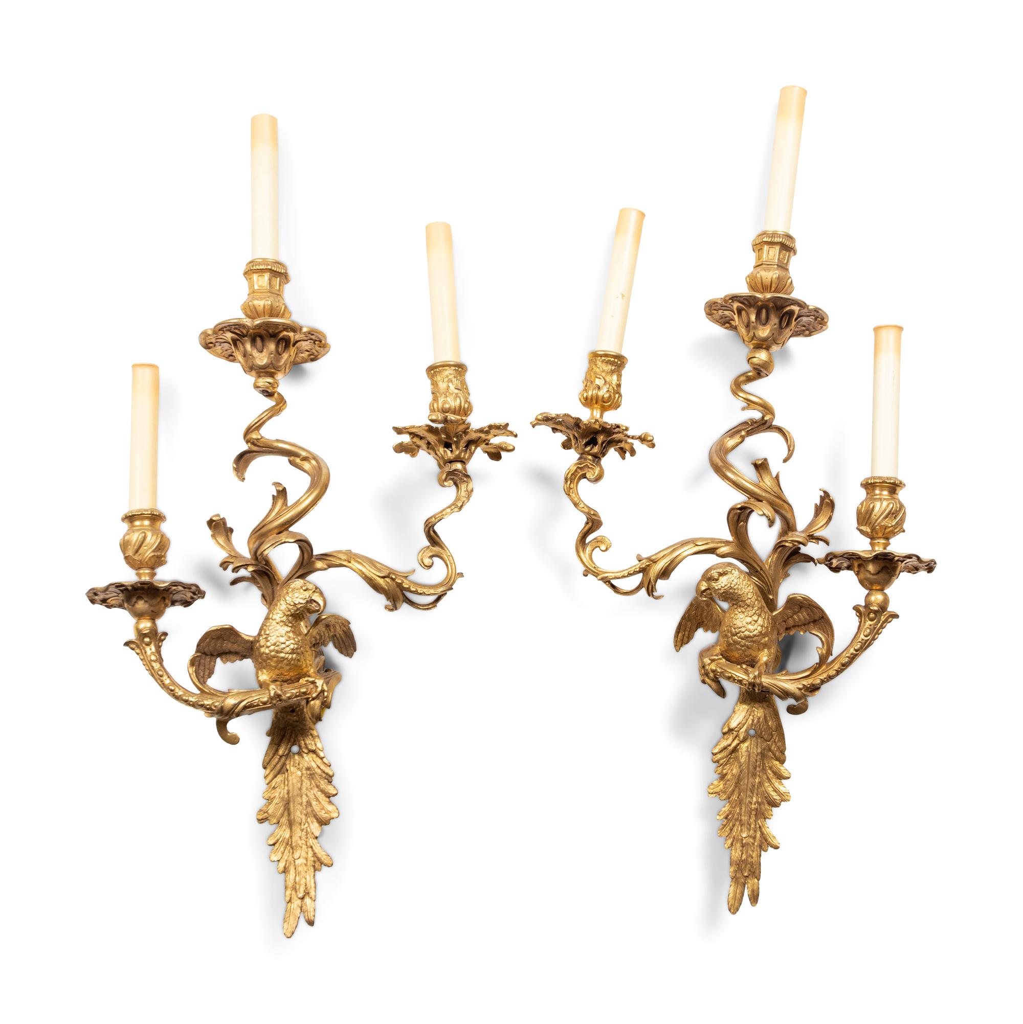A Pair of Louis XV Style Gilt Bronze Three-Light Sconces with Parrots