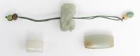 Three Celadon Jade Pendants Length of largest 1 1/2 inches.