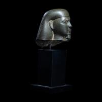 An Egyptian Schist Head of a Male