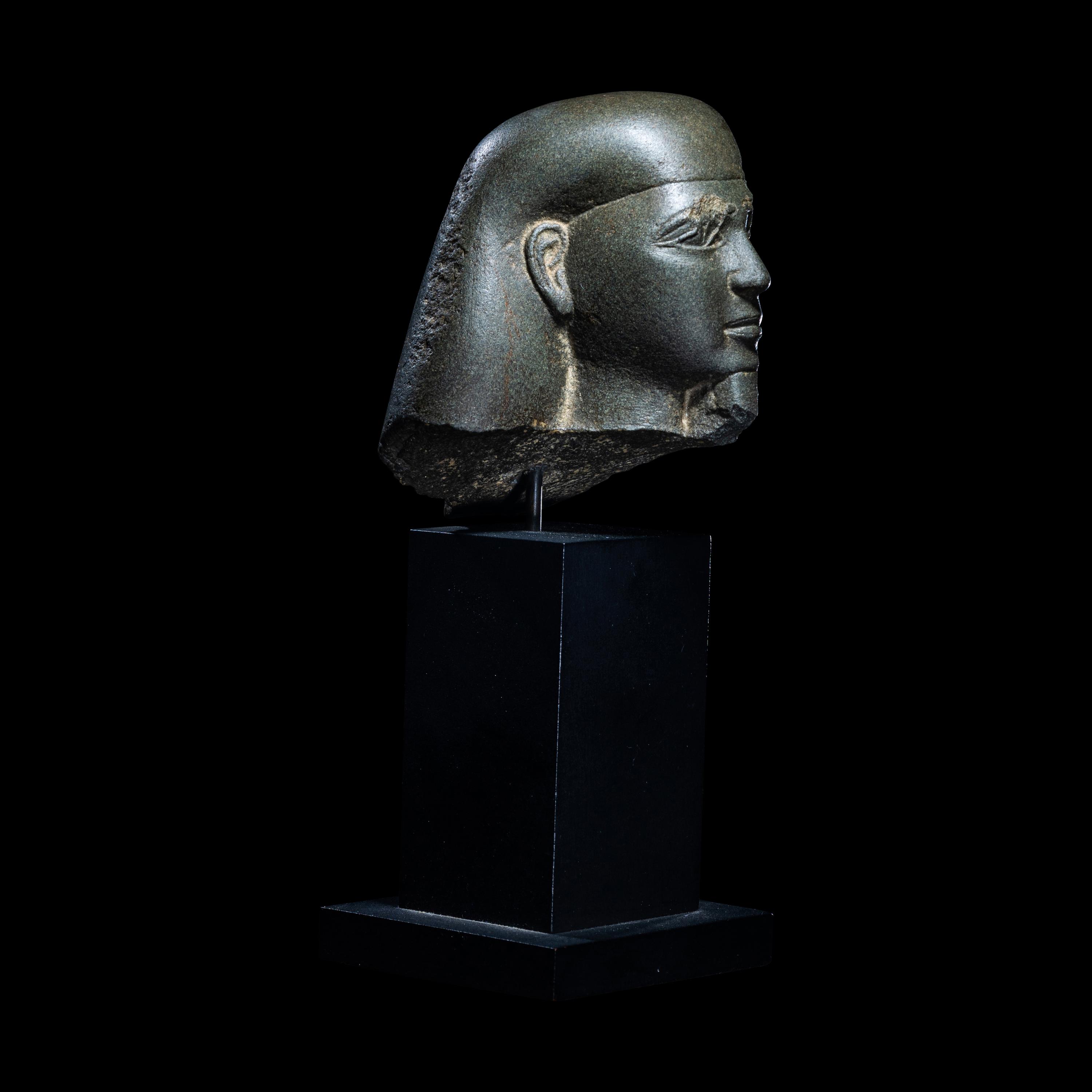 An Egyptian Schist Head of a Male