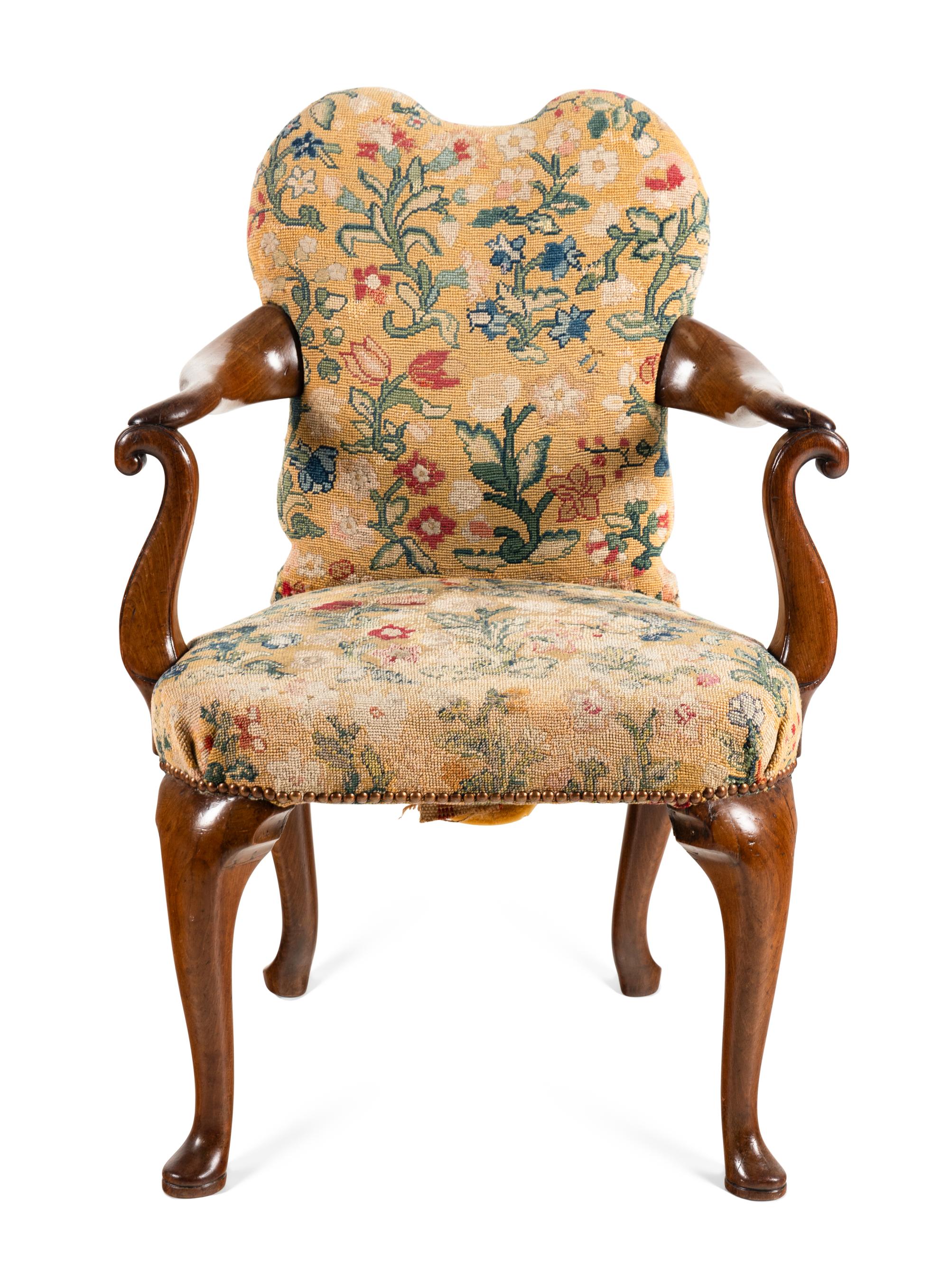 A George I Walnut and Needlework Upholstered Armchair