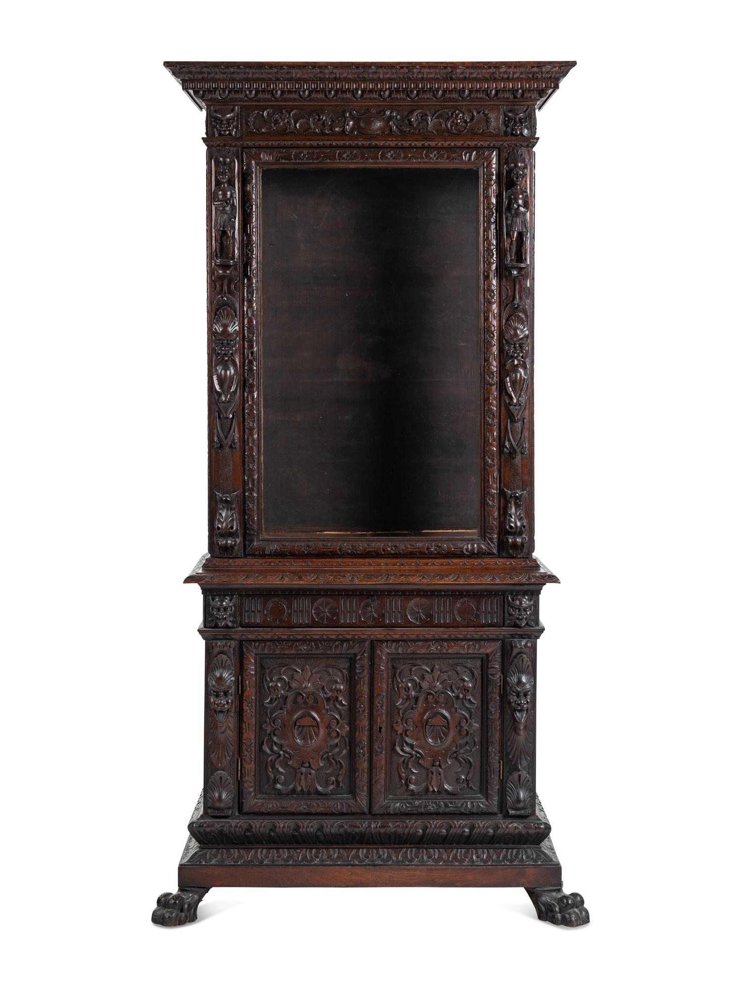 An Austrian Carved Walnut Cabinet