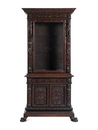 An Austrian Carved Walnut Cabinet