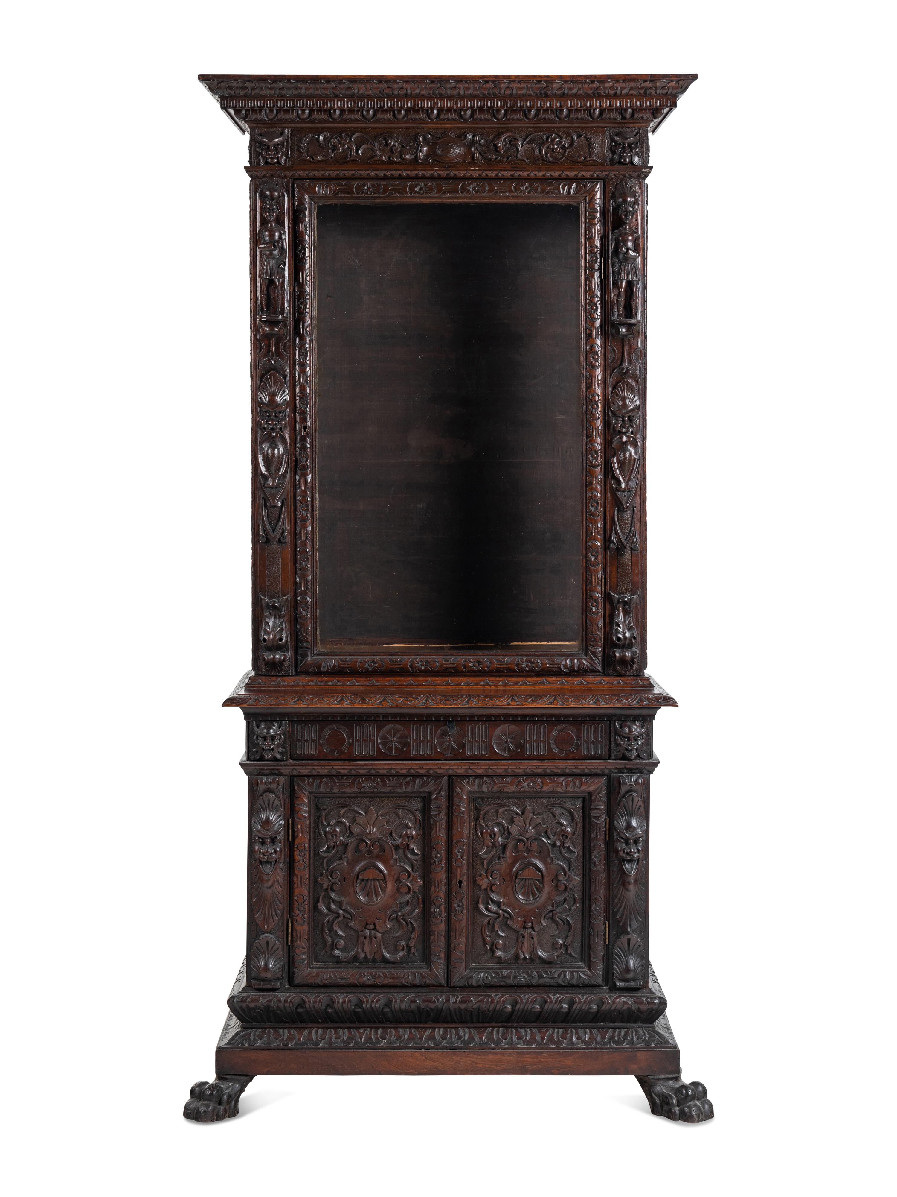 An Austrian Carved Walnut Cabinet