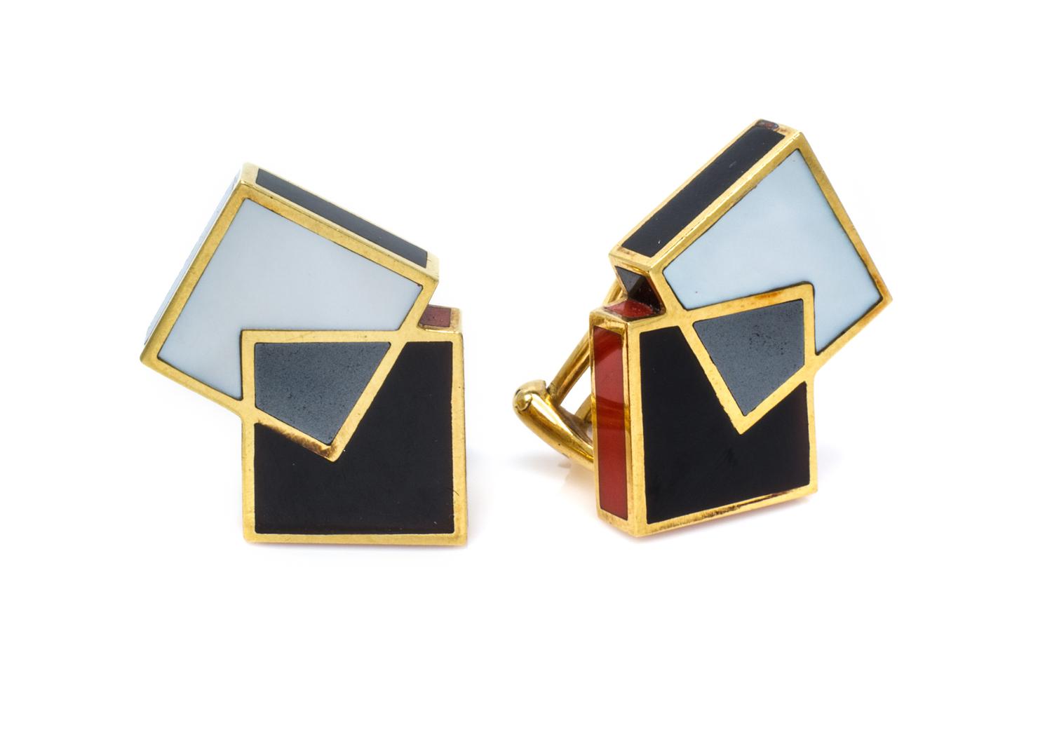 A Pair of 18 Karat Yellow Gold, Onyx, Coral, Steel and Mother-of-Pearl Earclips, Angela Cummings, Circa 1985, 8.90 dwts.