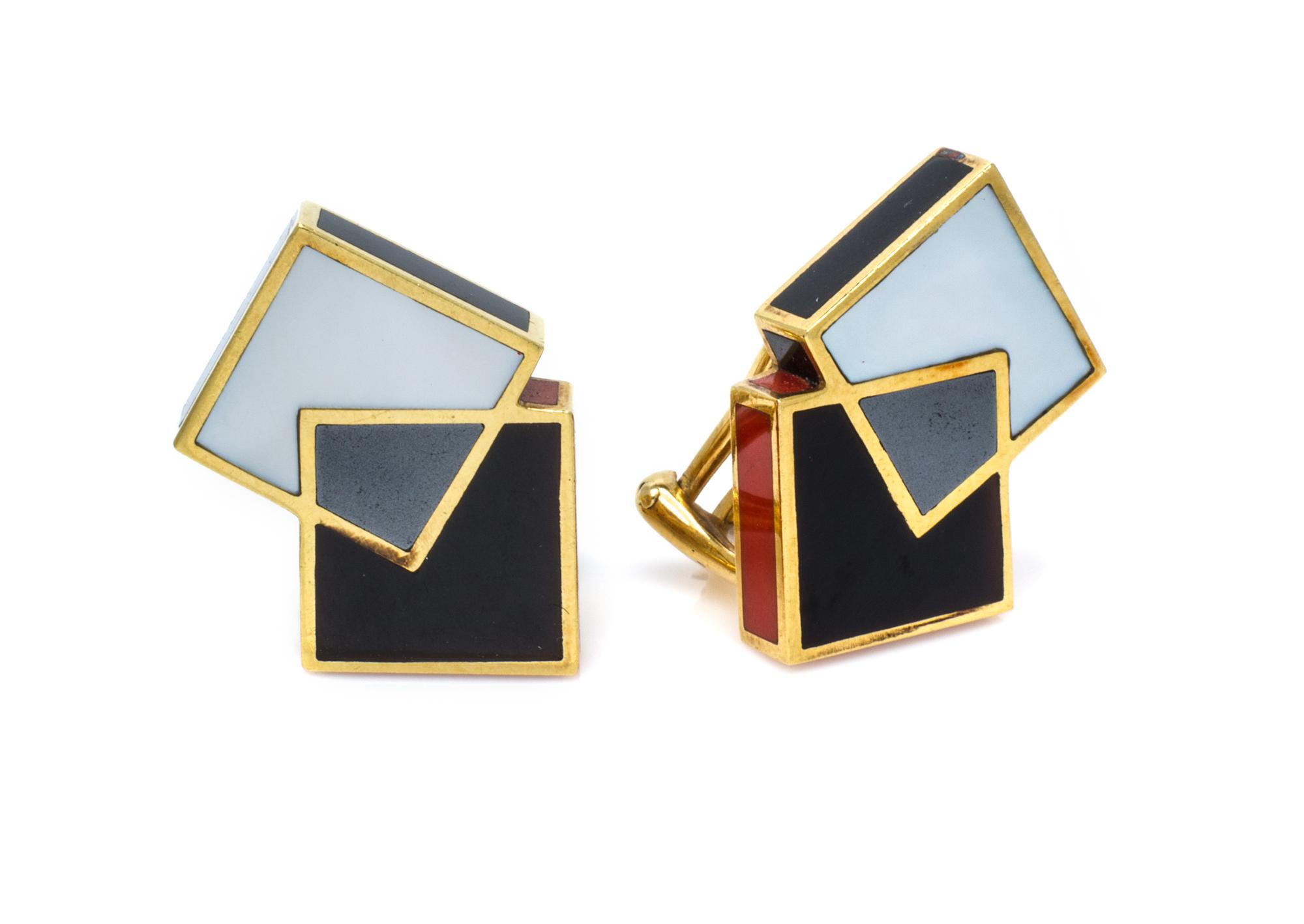 A Pair of 18 Karat Yellow Gold, Onyx, Coral, Steel and Mother-of-Pearl Earclips, Angela Cummings, Circa 1985, 8.90 dwts.