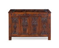 A Gothic Style Carved Walnut Chest